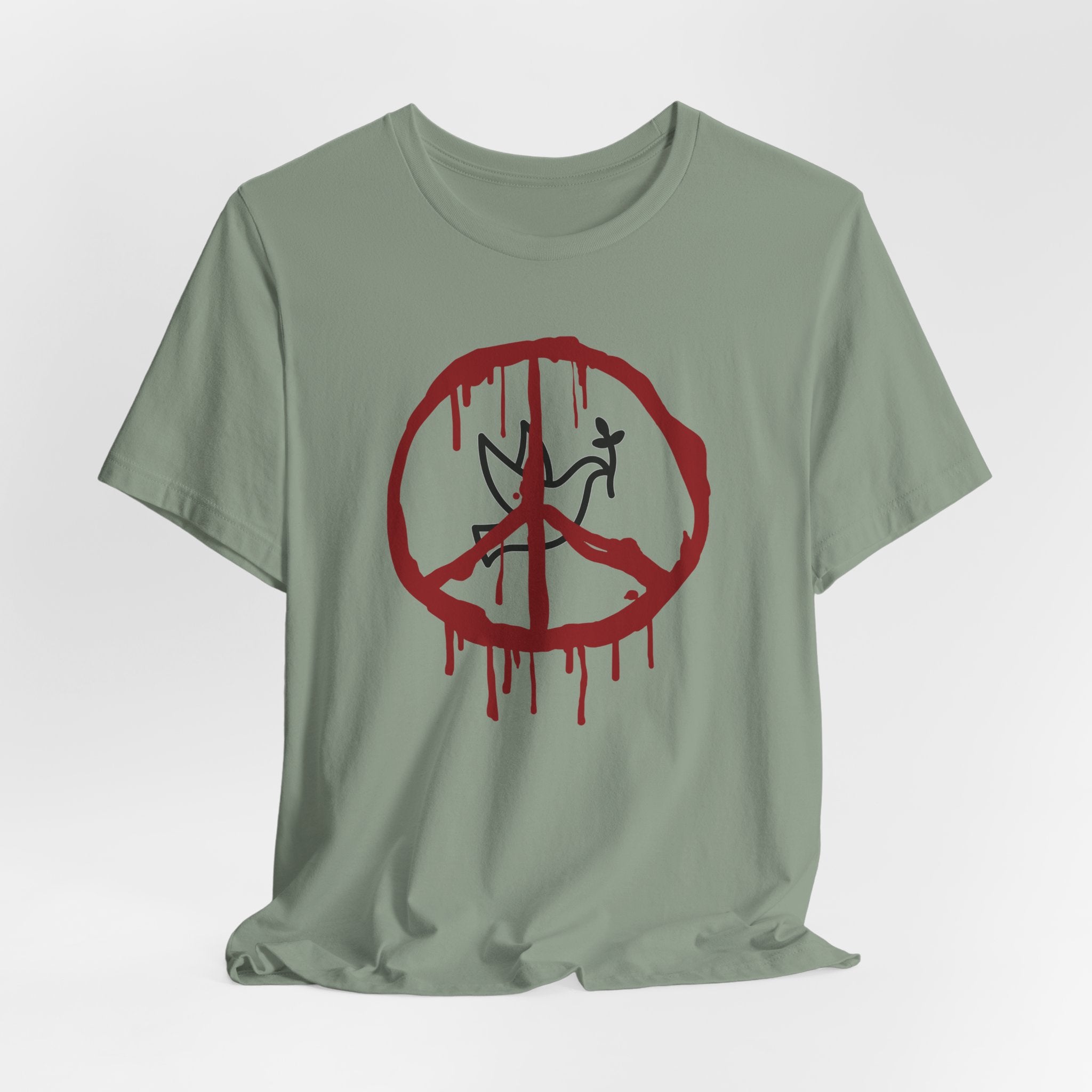 Sage green t-shirt with a bloody peace symbol design in front of dove graphic on a white background