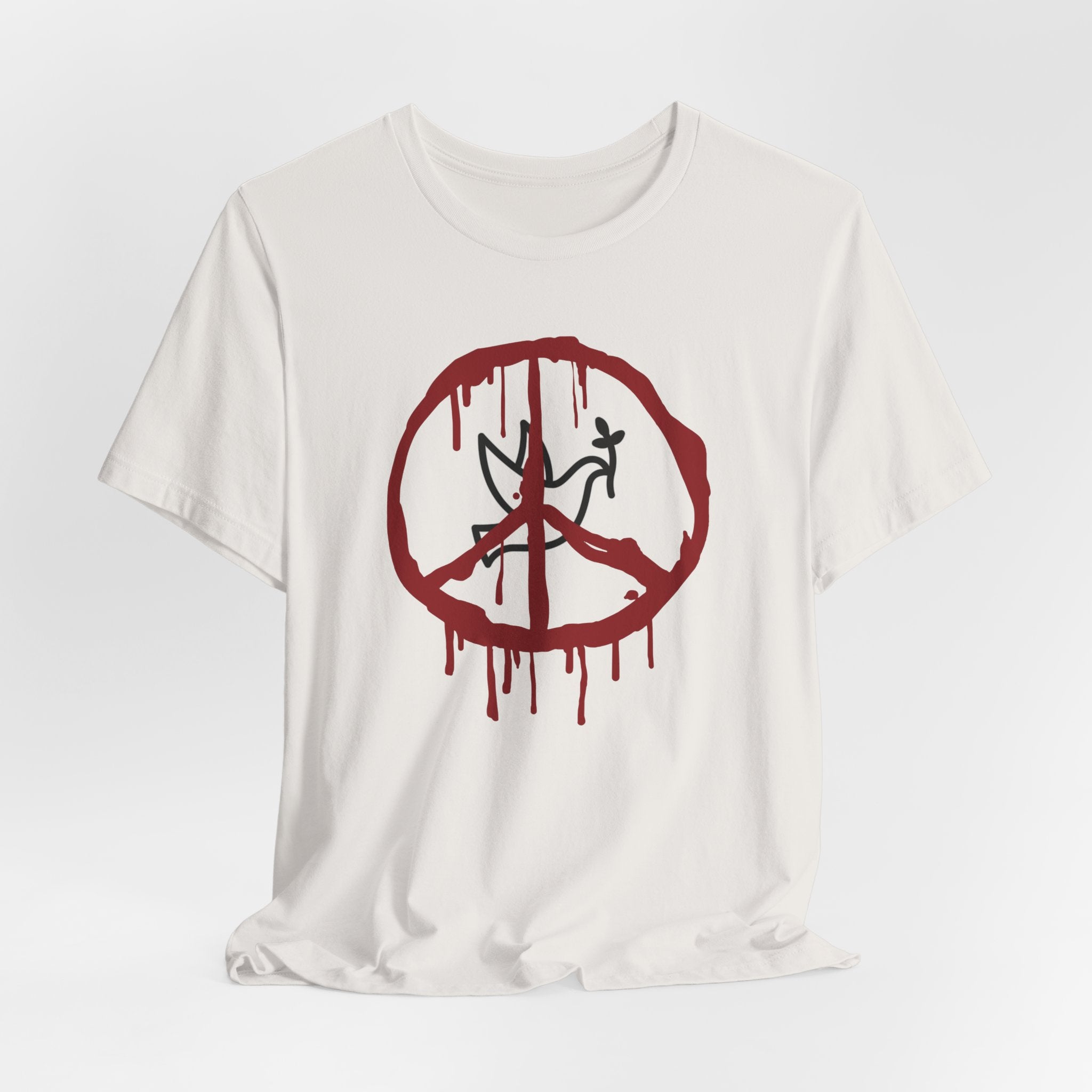 Vintage white t-shirt with a bloody peace symbol design in front of dove graphic on a white background
