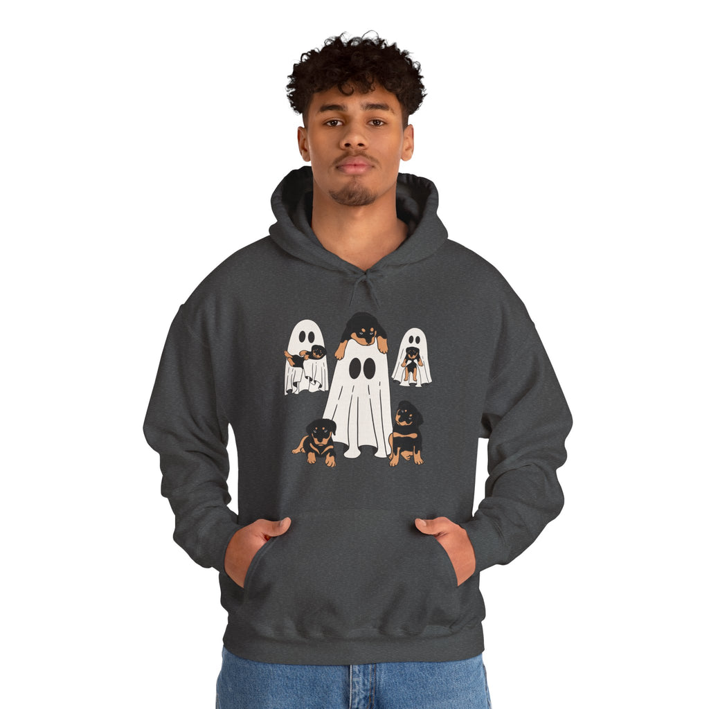 Person wearing a dark gray hoodie with ghost and dog design on a white background