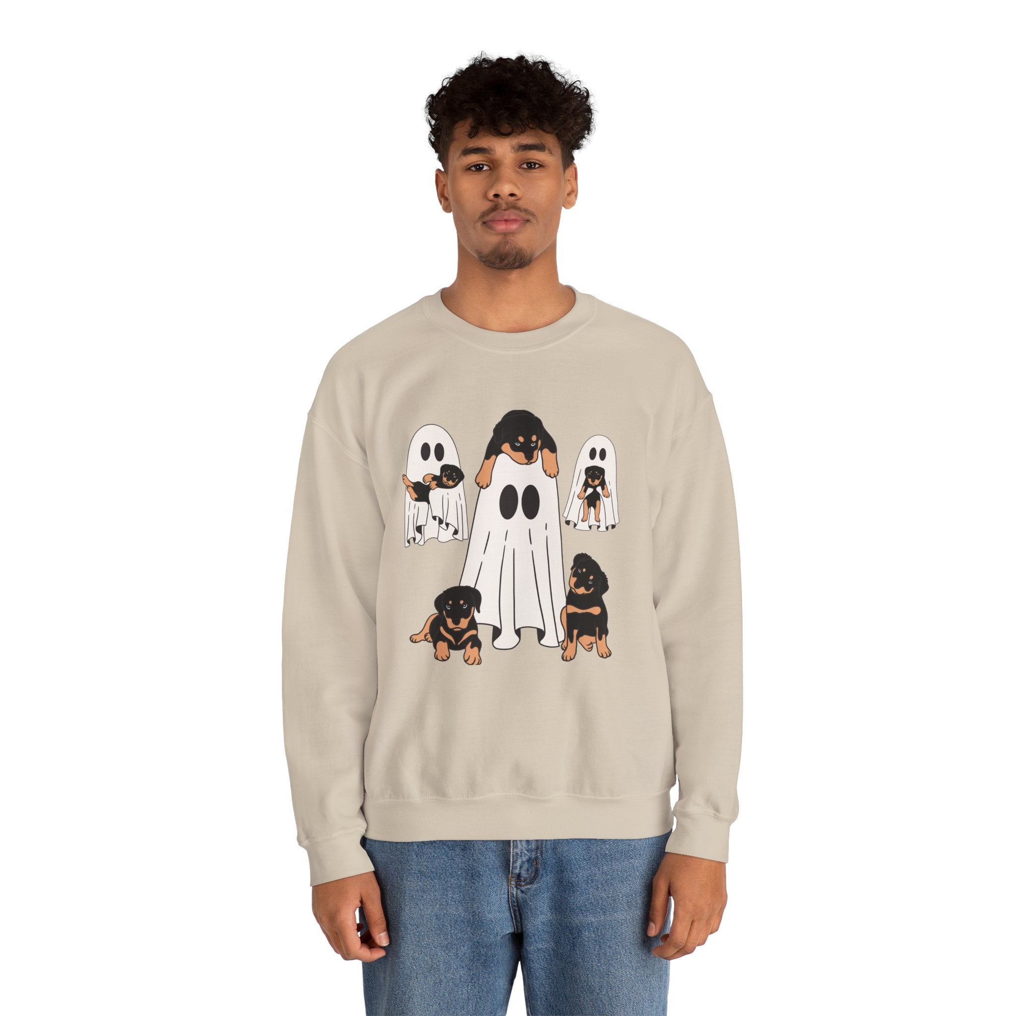 Person wearing a beige sweatshirt with ghost and dog illustrations on a white background