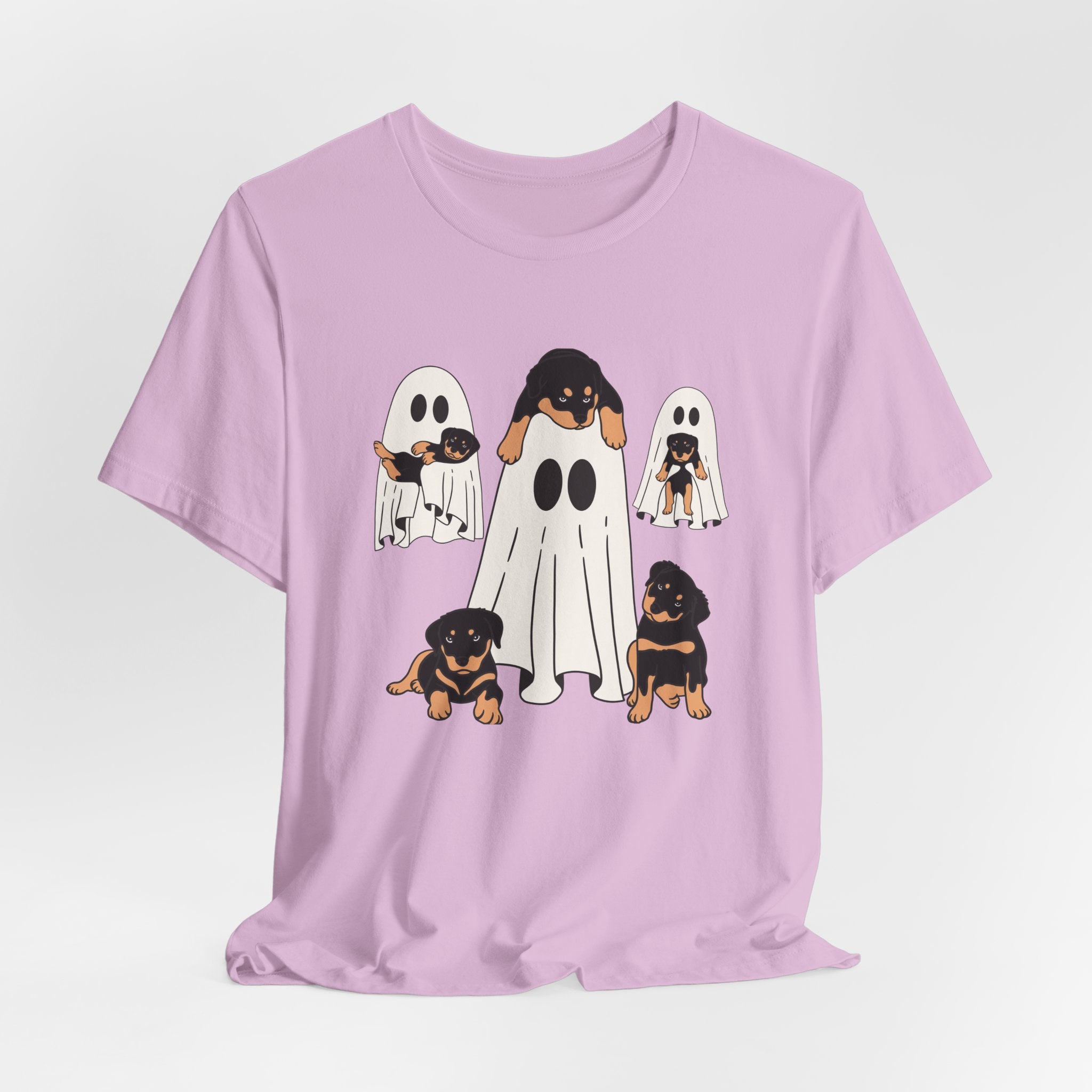 Lilac purple t-shirt with cartoon ghosts and dogs design on a light purple background
