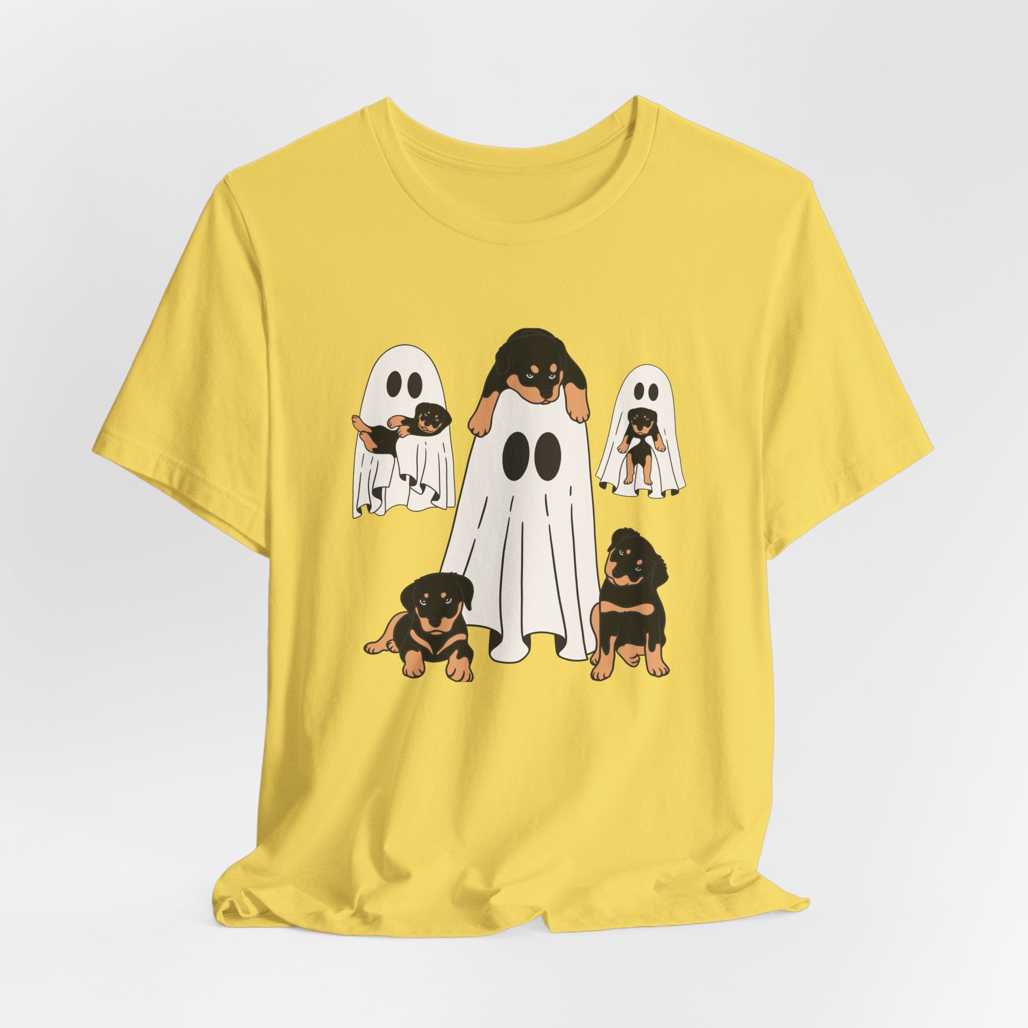 Yellow t-shirt with cartoon ghost and dog design on a white background