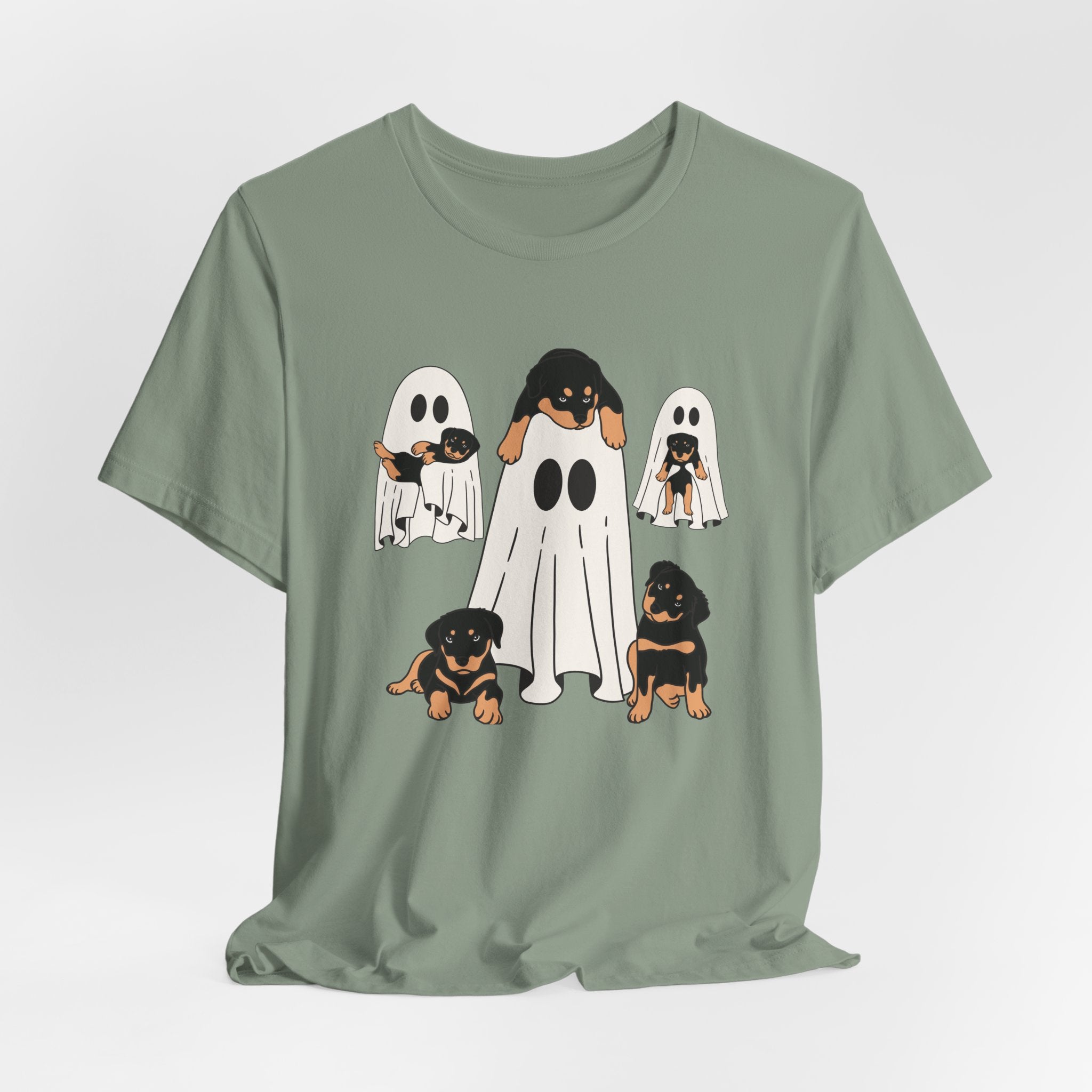 Sage green t-shirt with ghost and dog design on a white background