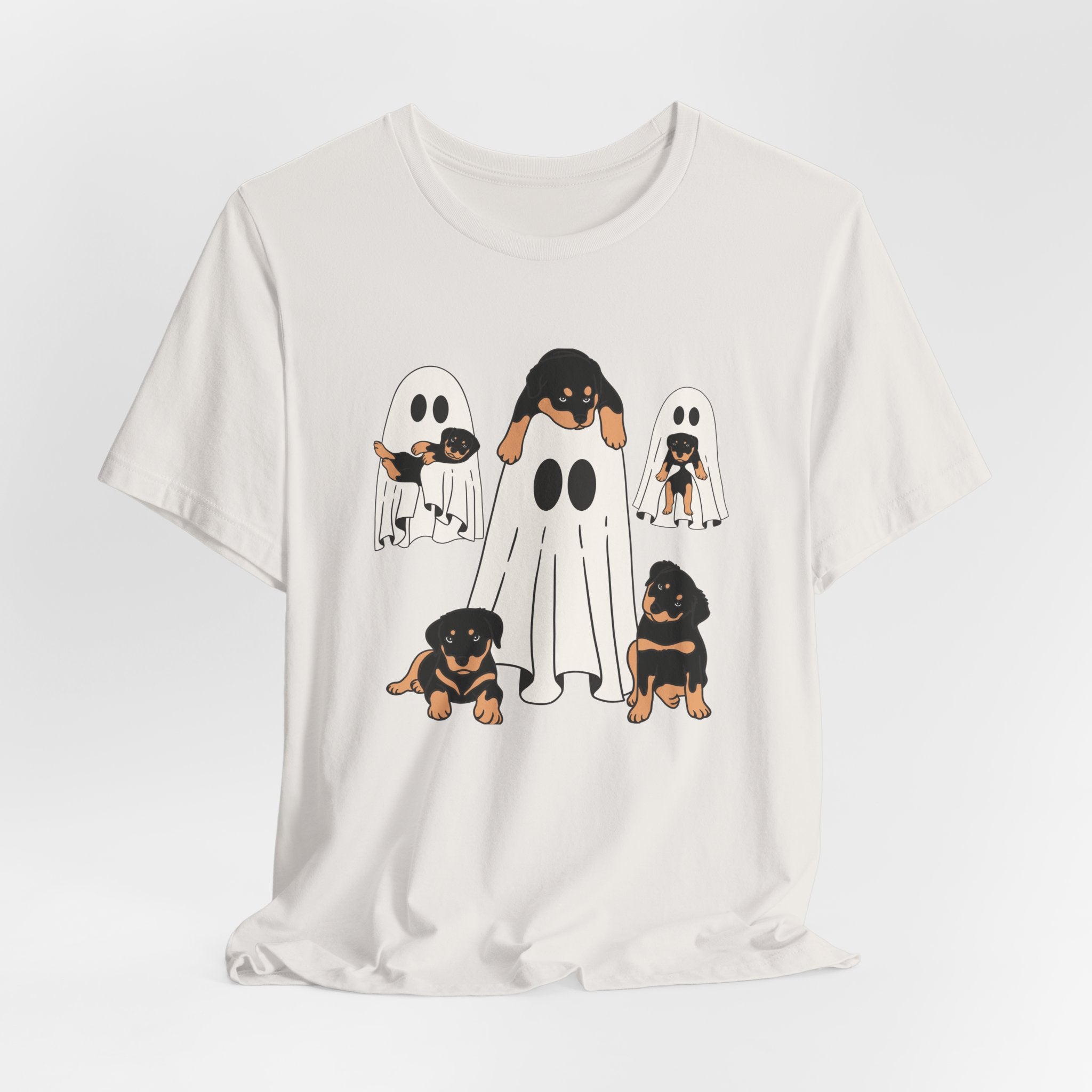 Vintage white t-shirt with cartoon ghost design featuring small dogs on a white background