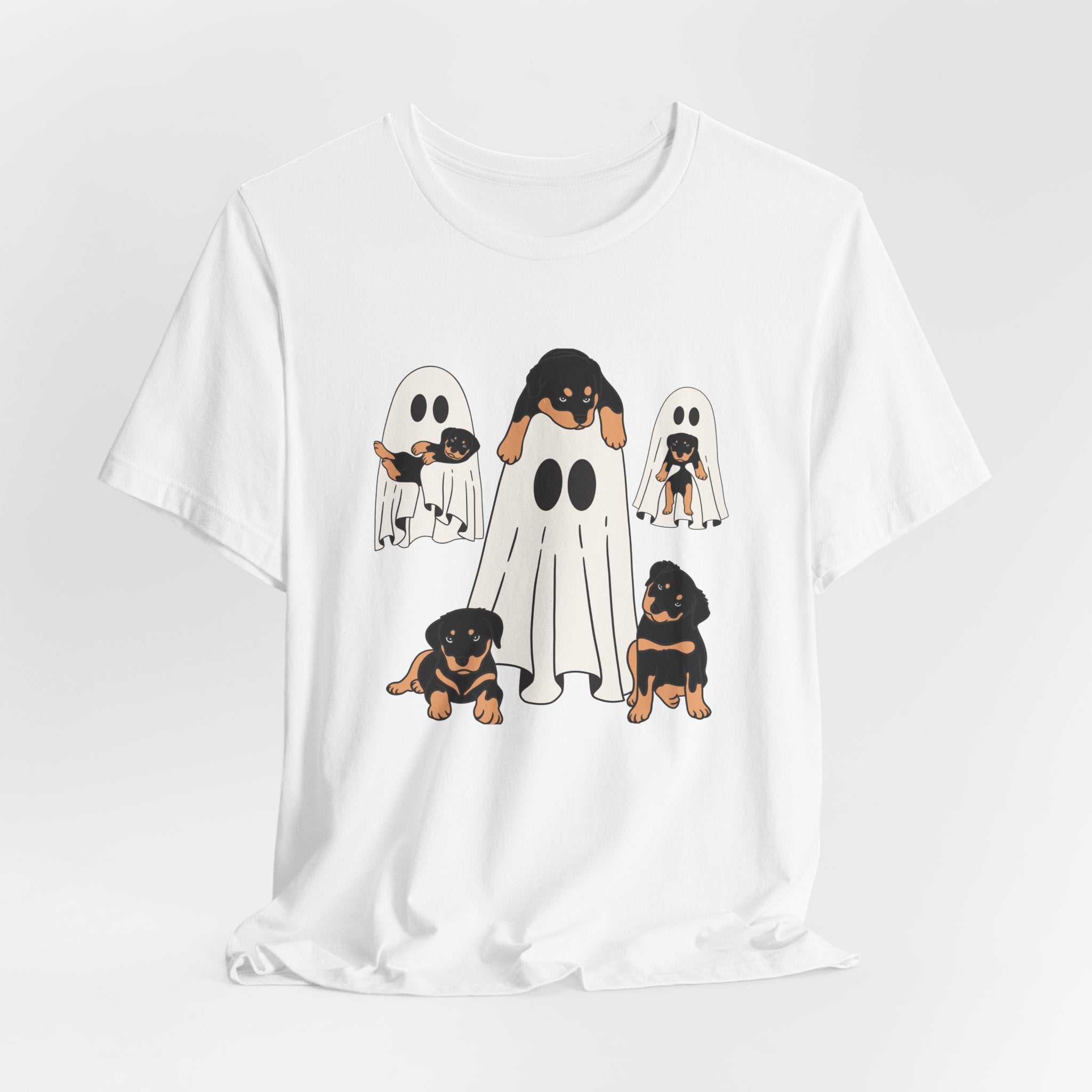White t-shirt with a graphic of dogs dressed as ghosts on a white background