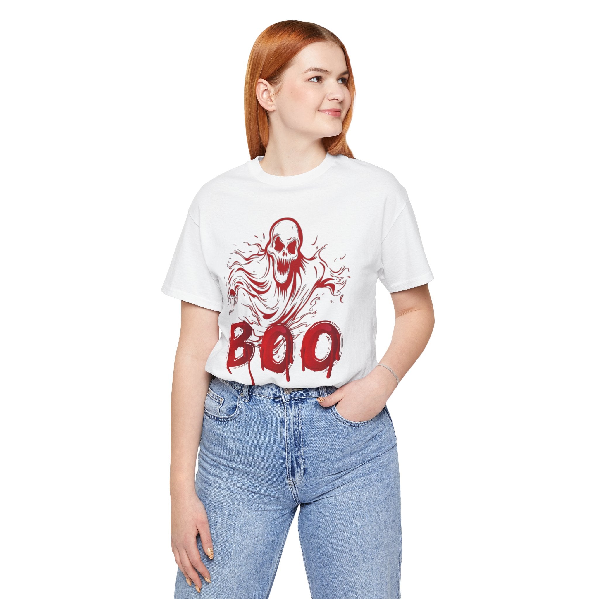 Person wearing a white t-shirt with a red ghost and 'BOO' design on a white background