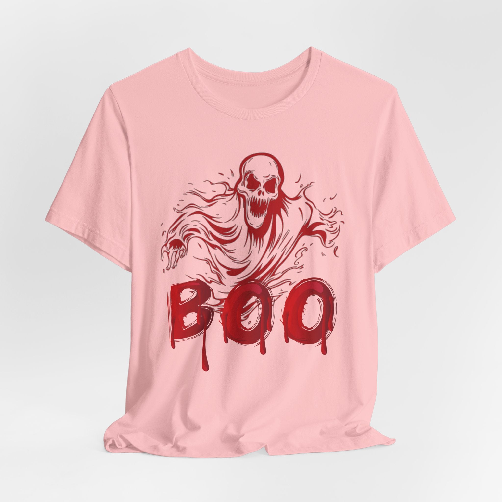 Pink t-shirt with red ghost graphic and 'BOO' text on a light gray background