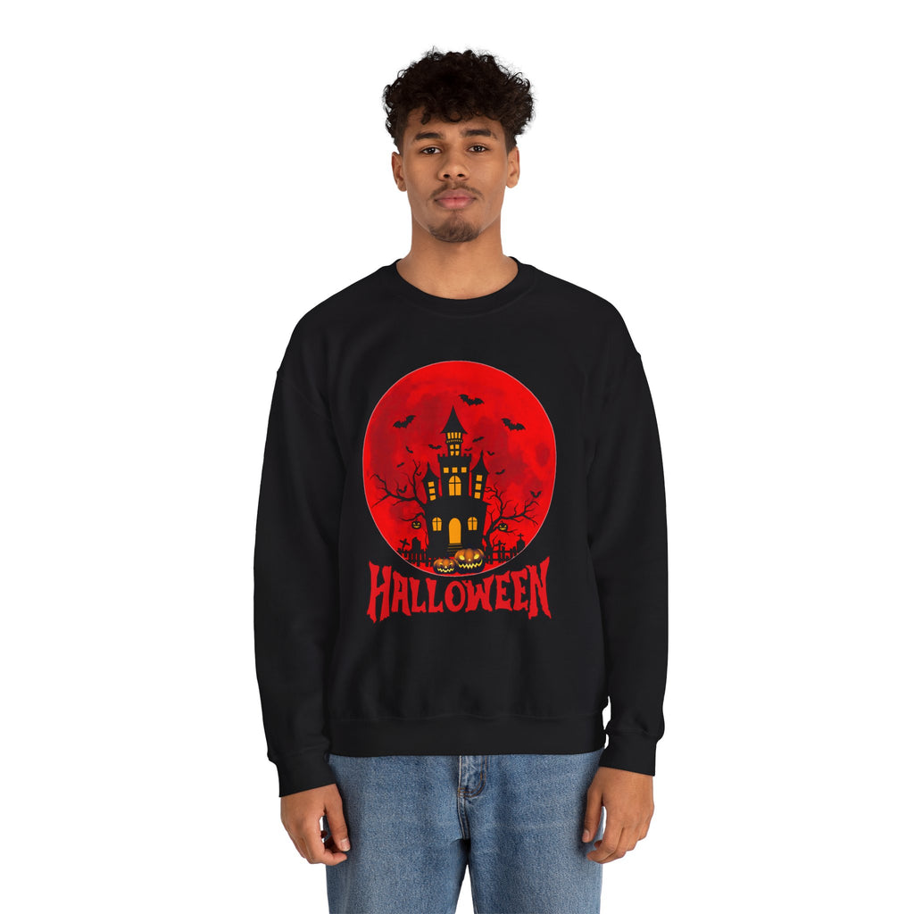 Person wearing a black sweatshirt with a Halloween design featuring a castle and 'Halloween' text on a white background.