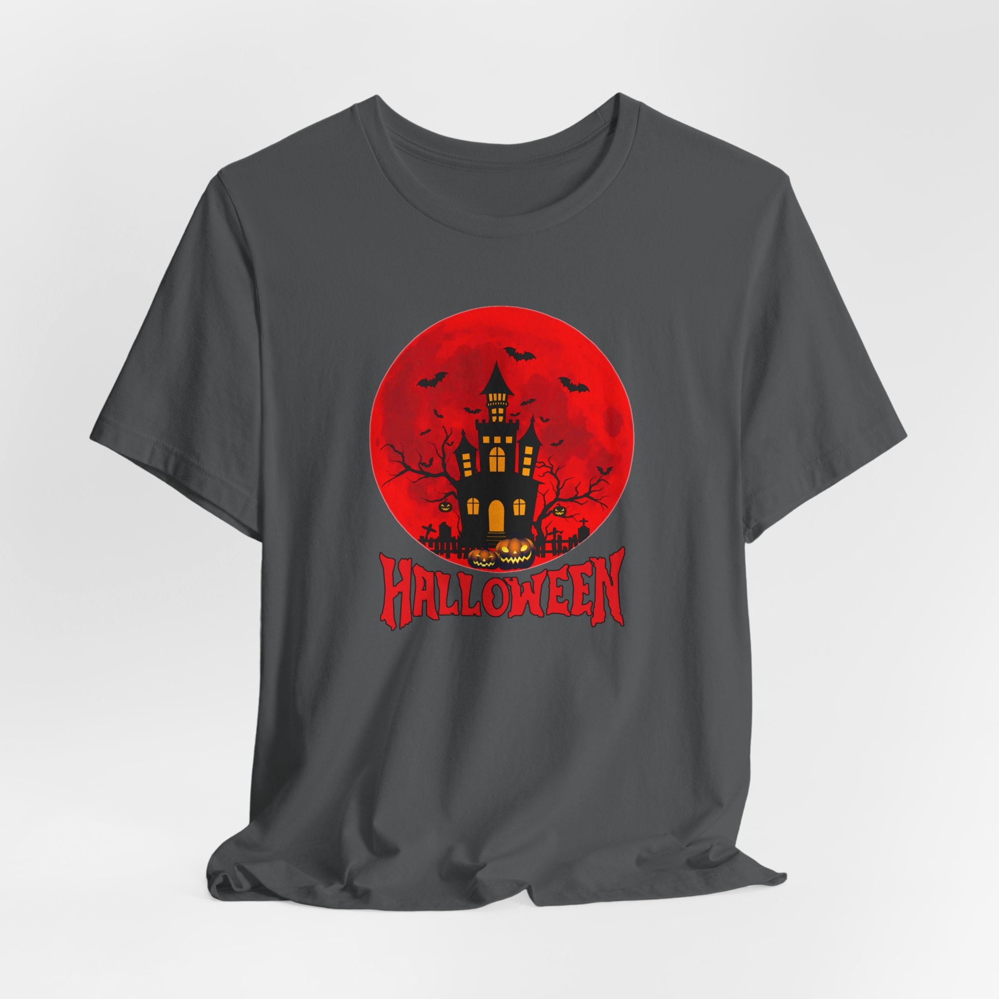 Gray t-shirt with Halloween-themed design featuring a castle and bats under the red moon and pumpkins on a red background.