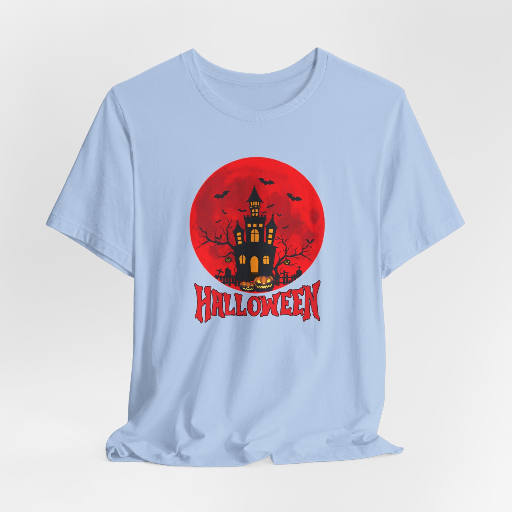 Baby blue t-shirt with Halloween graphic featuring a castle, bats, pumpkin under the red moon and 'Halloween' text on a red background.