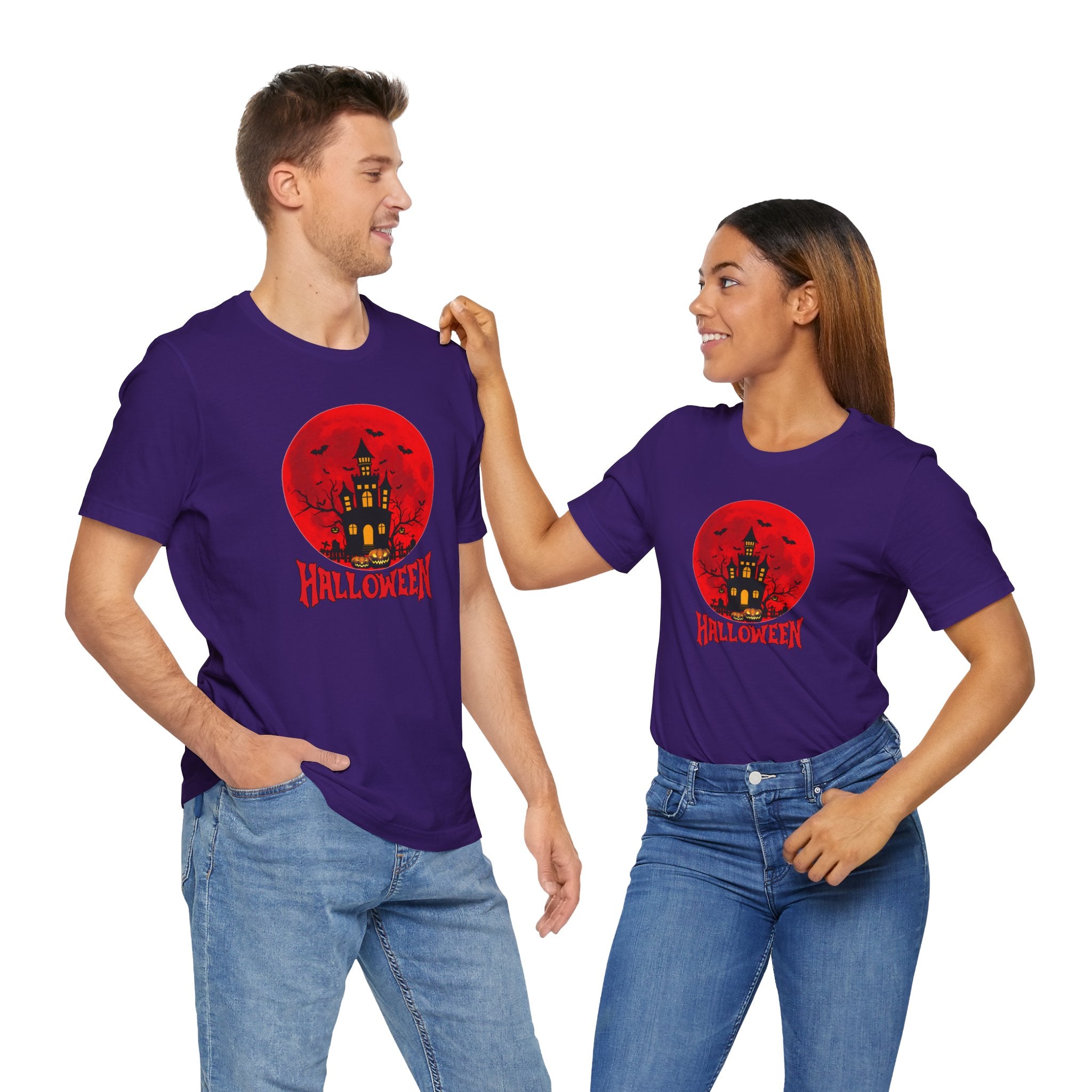 Two people wearing purple Halloween t-shirts with a red moon and castle design on a white background.