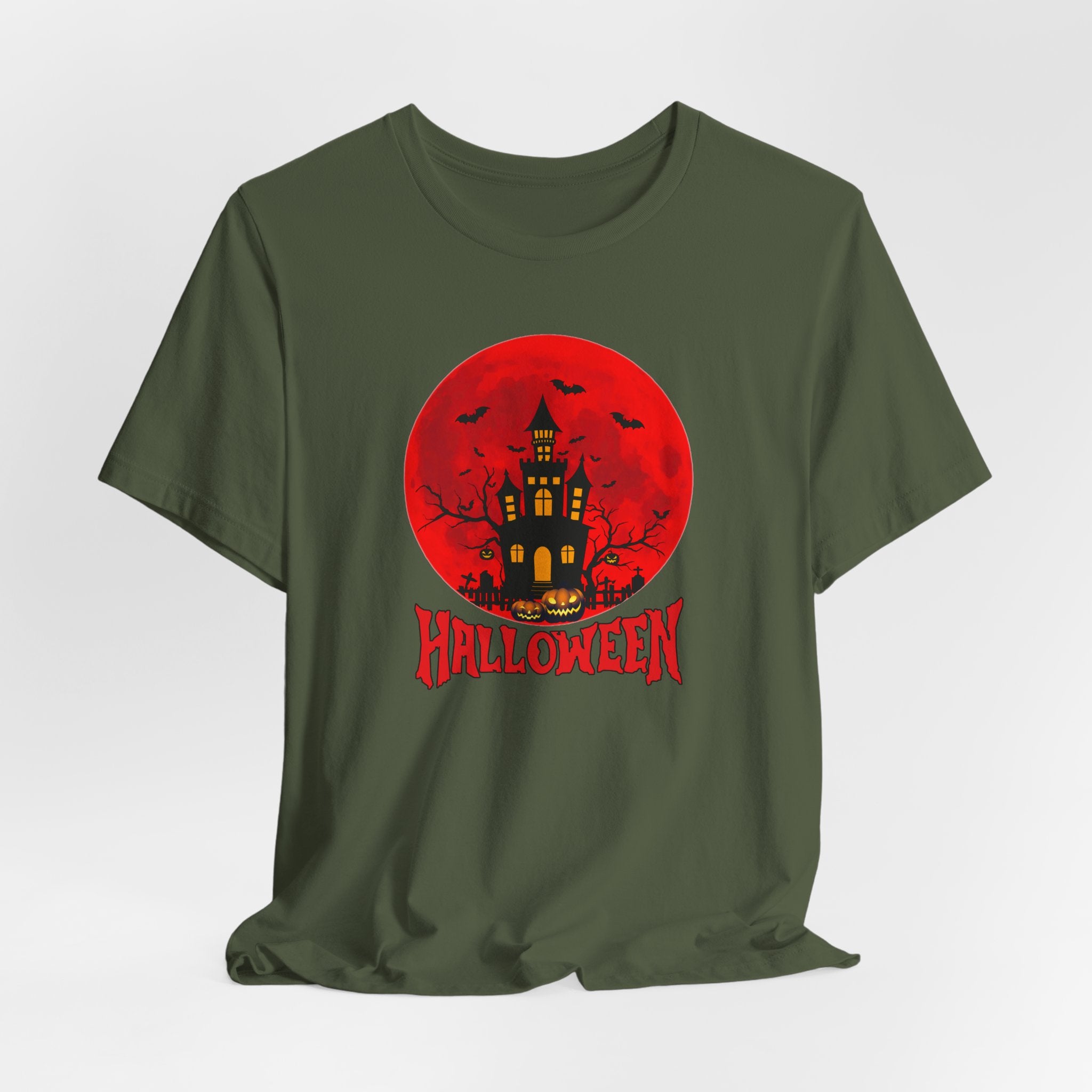Green t-shirt with Halloween graphic featuring a castle and pumpkins on a red moon background