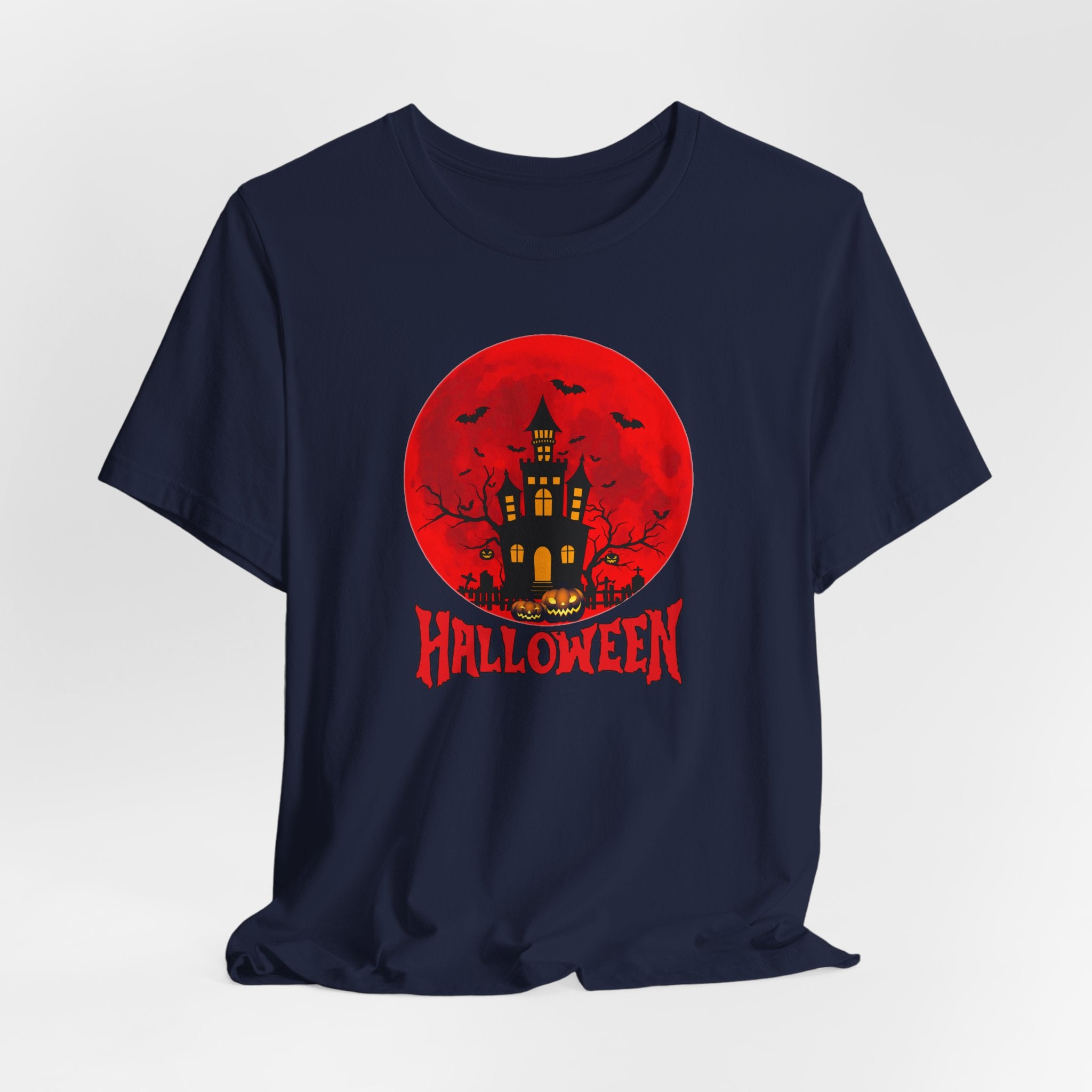 Navy blue t-shirt with Halloween graphic featuring a castle and pumpkins on a red moon background.