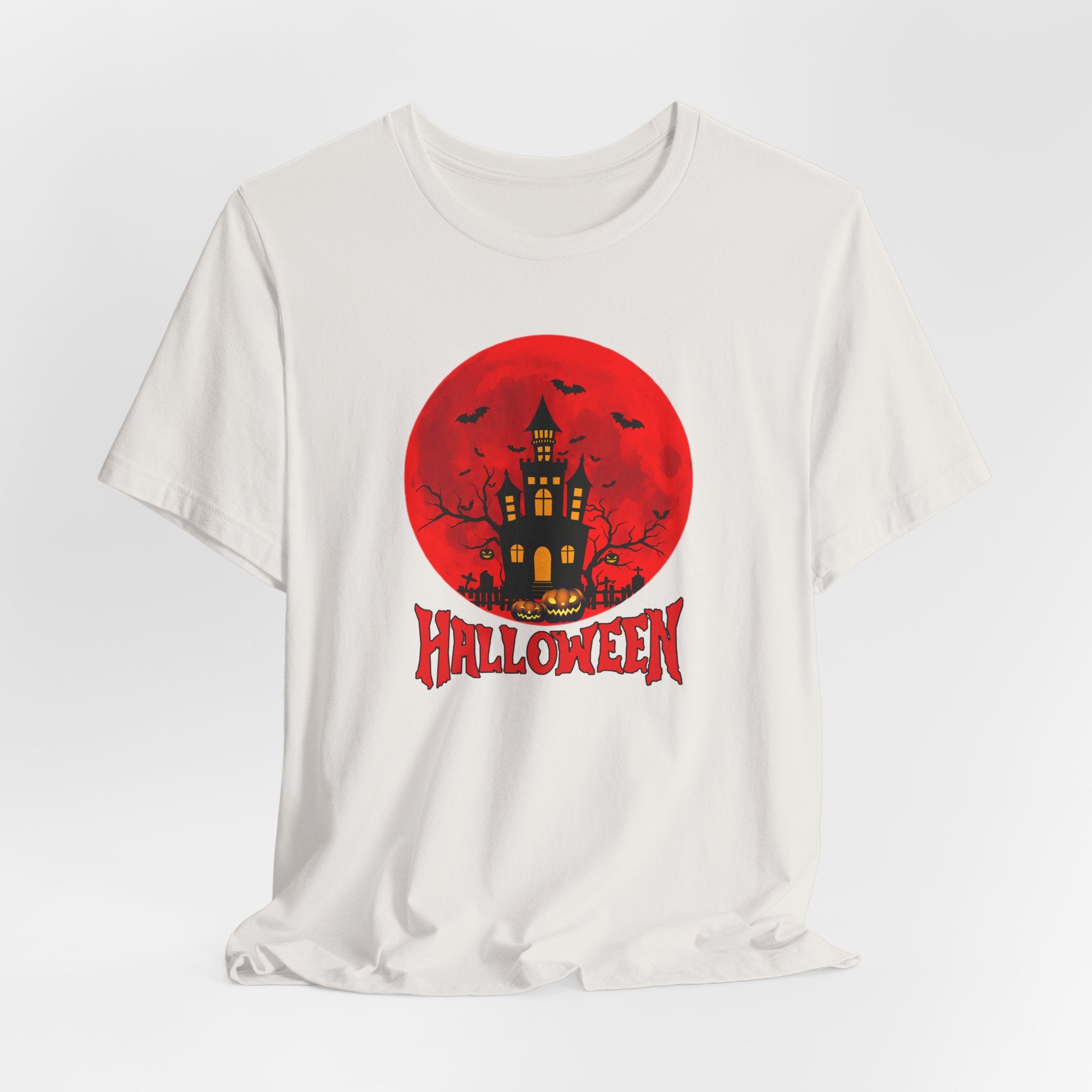 Vintage white t-shirt with Halloween graphic featuring a castle, bats, pumpkin and 'Halloween' text on a red moon.