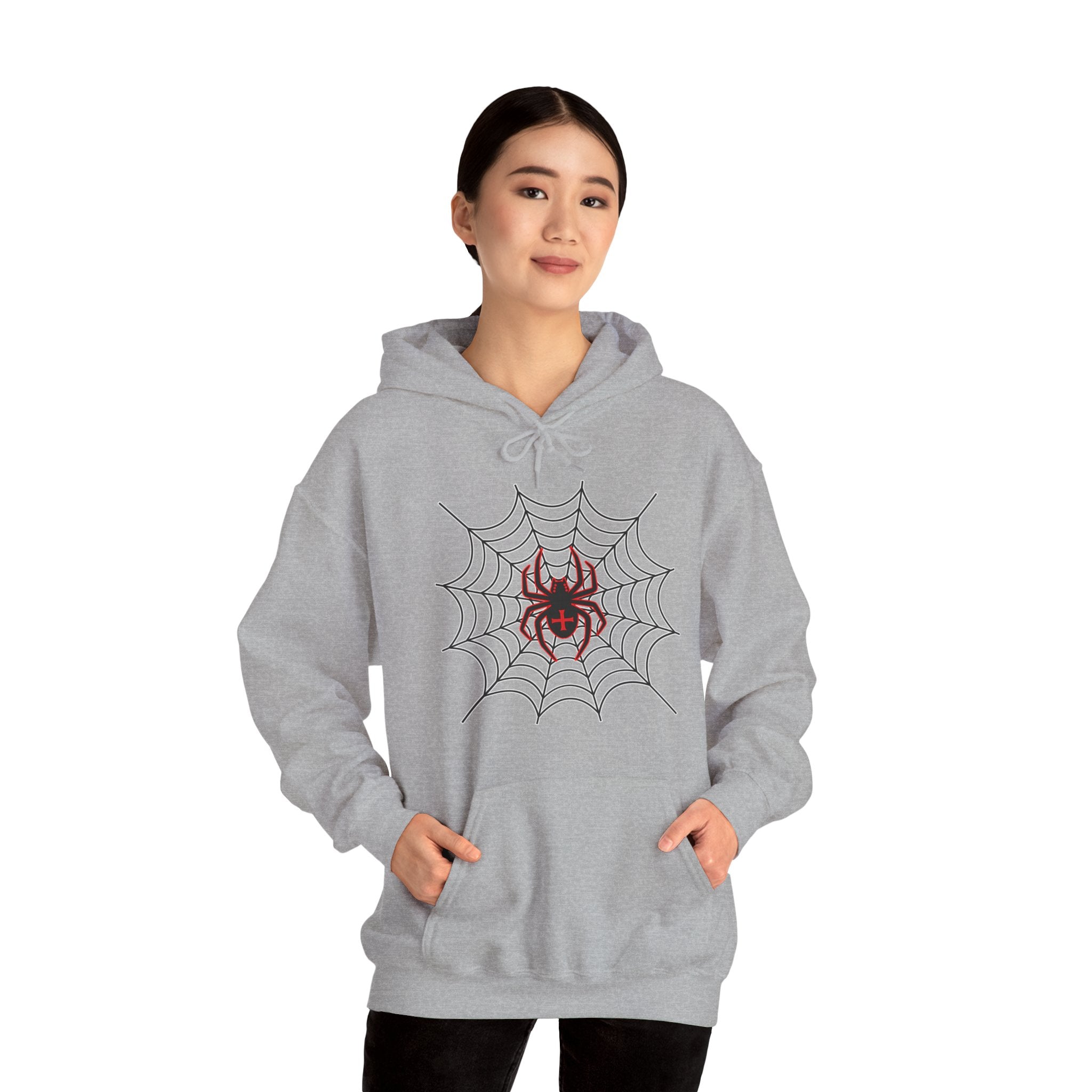 Person wearing a gray hoodie with a spider web and spider design on a white background