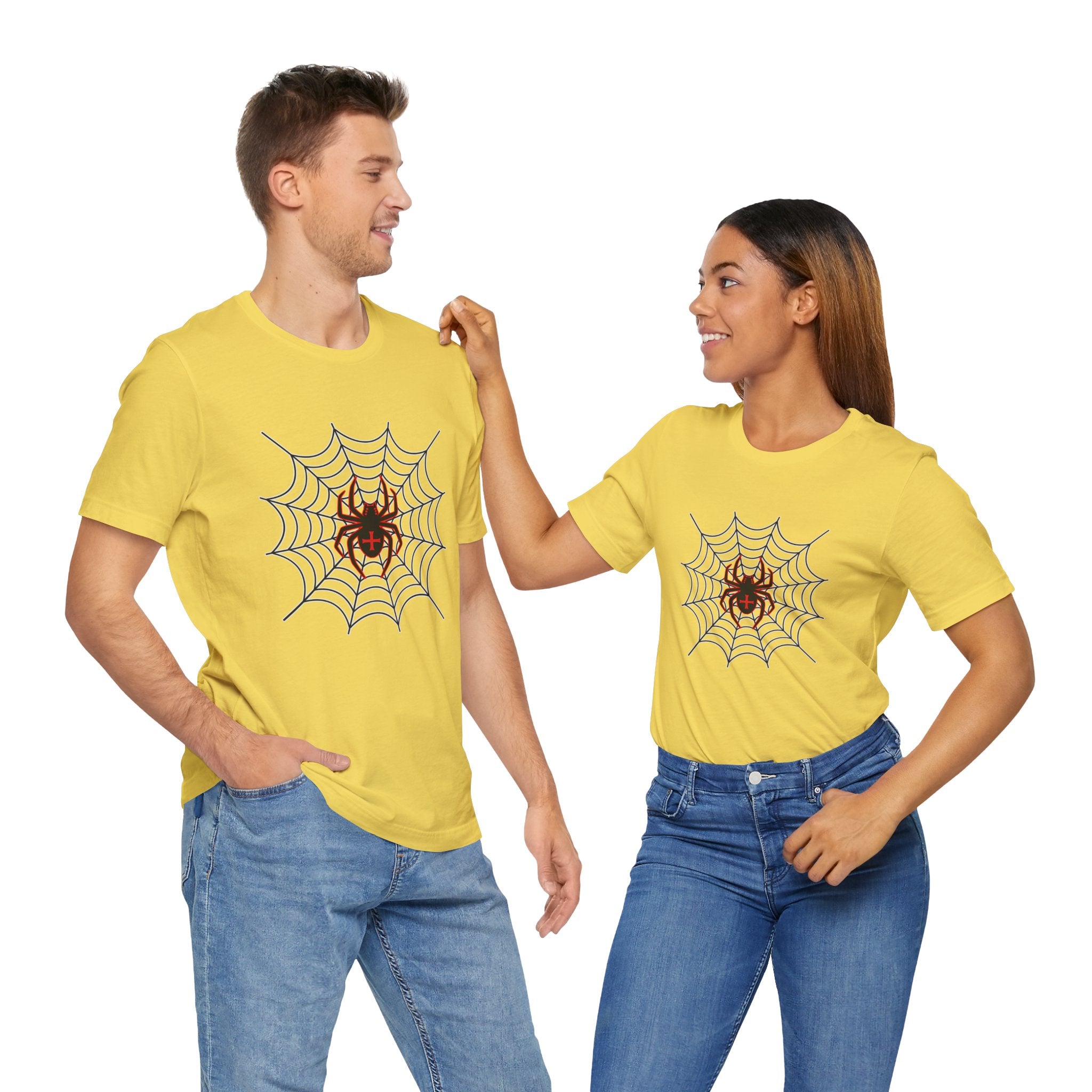 Two people wearing yellow t-shirts with spider web designs on a white background