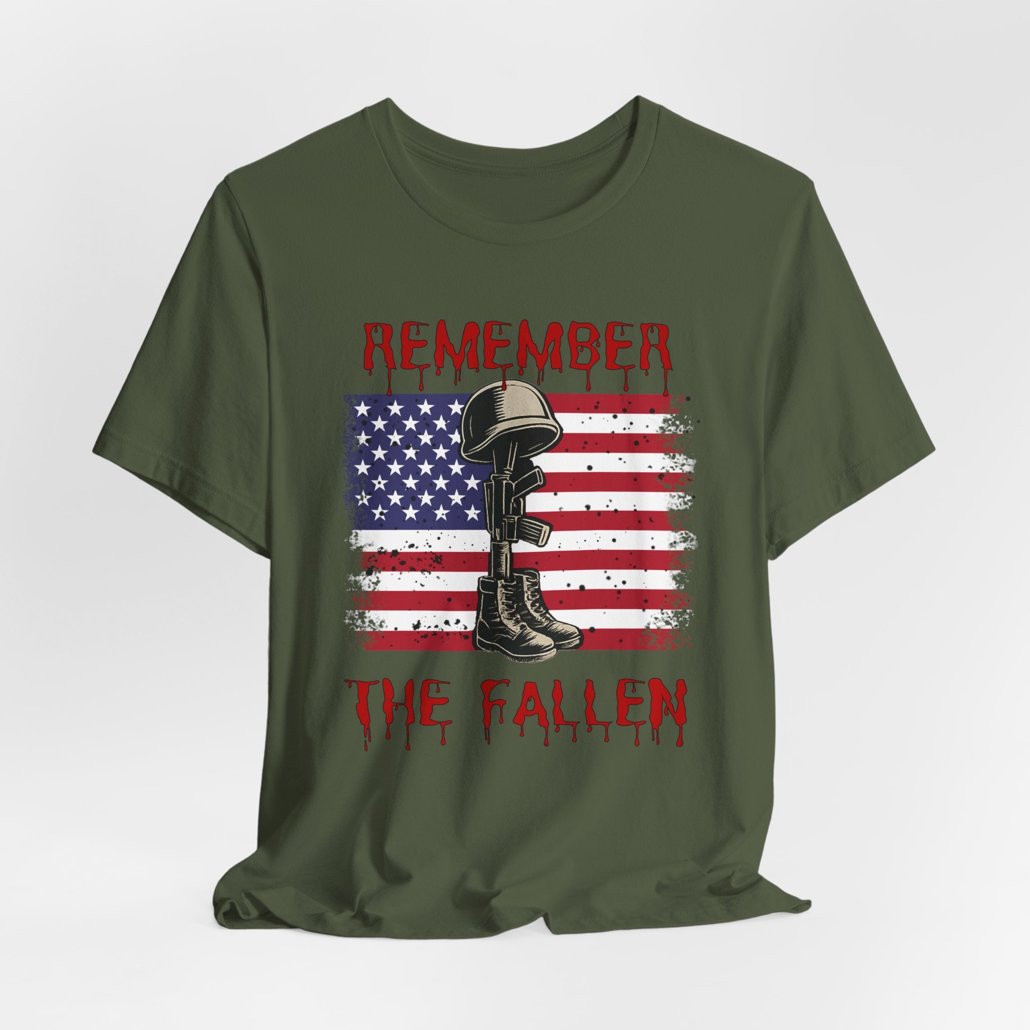 Military green t-shirt with vintage American flag and military gear themed design with remember the fallen text on a white background