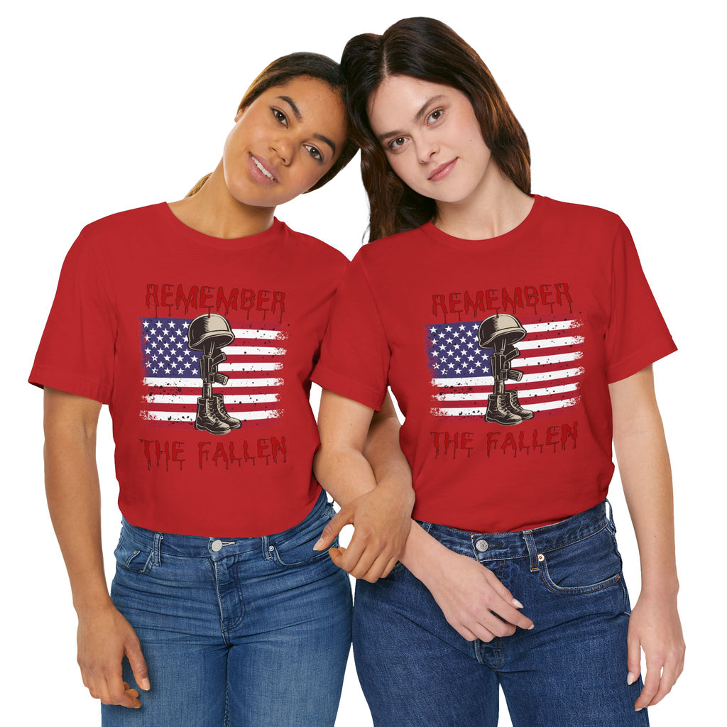 Two people wearing red t-shirt with vintage American flag and military gear themed design with remember the fallen text on a white background