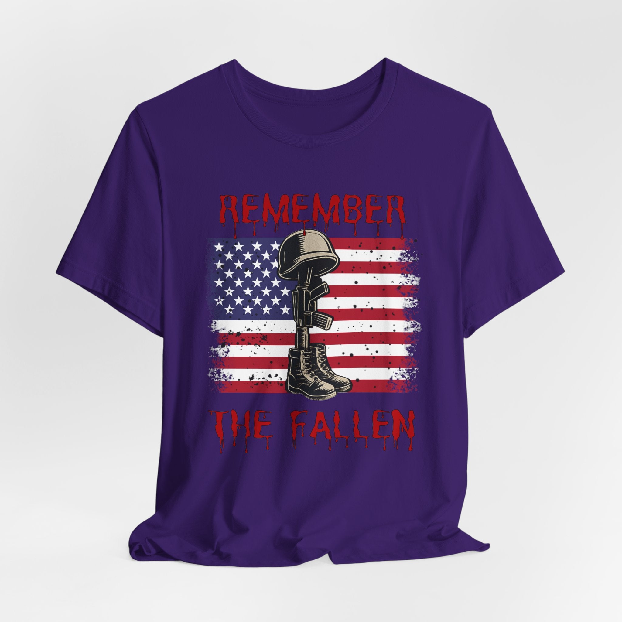 Team purple t-shirt with vintage American flag and military gear themed design with remember the fallen text on a white background