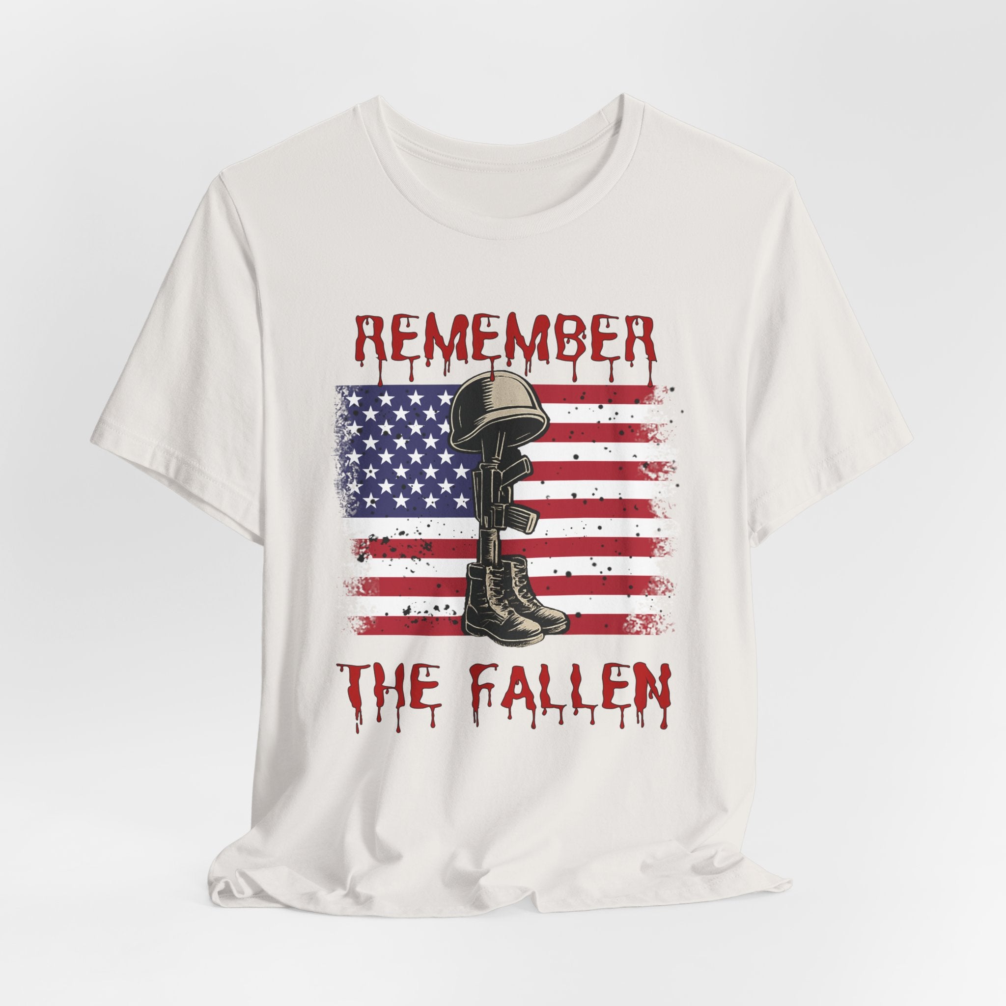 Vintage white t-shirt with vintage American flag and military gear themed design with remember the fallen text on a white background