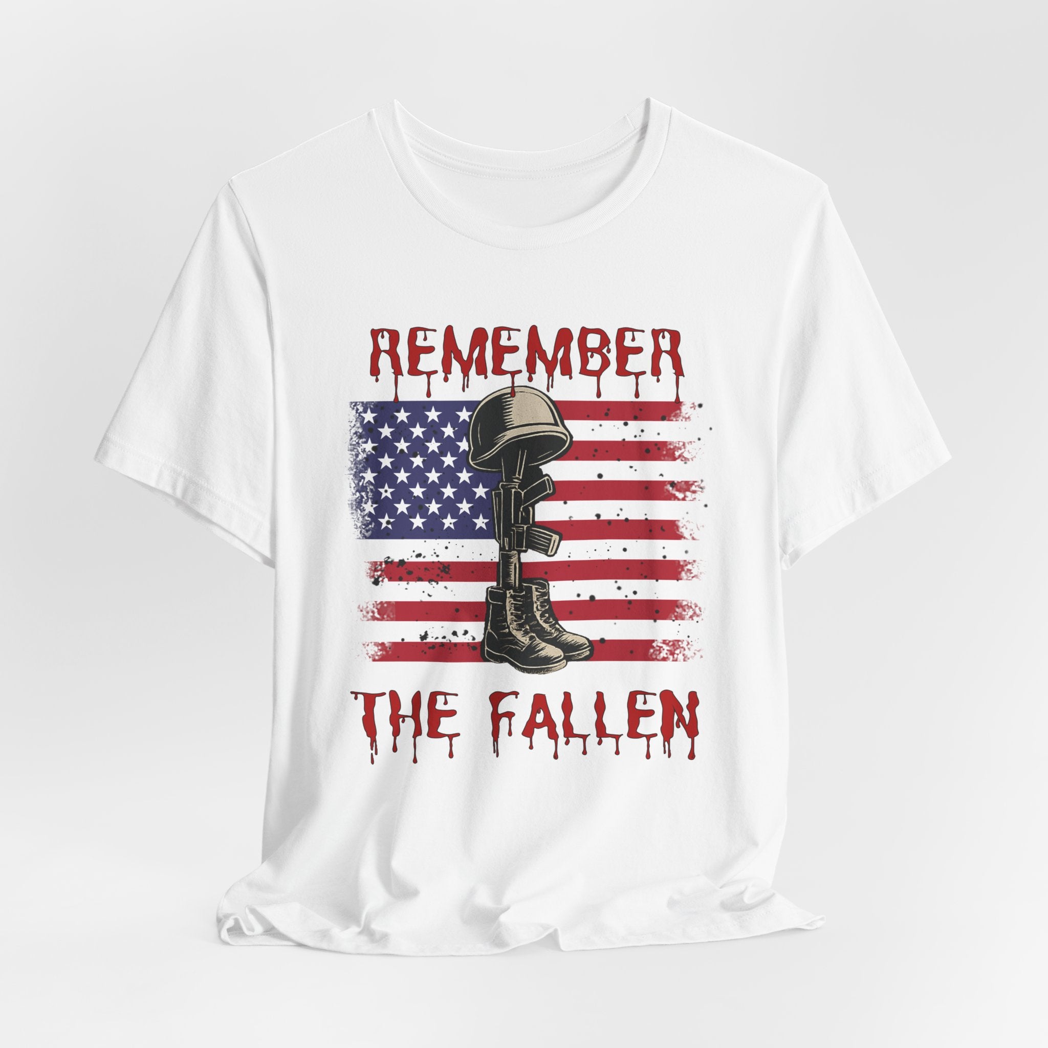 White t-shirt with vintage American flag and military gear themed design with remember the fallen text on a white background