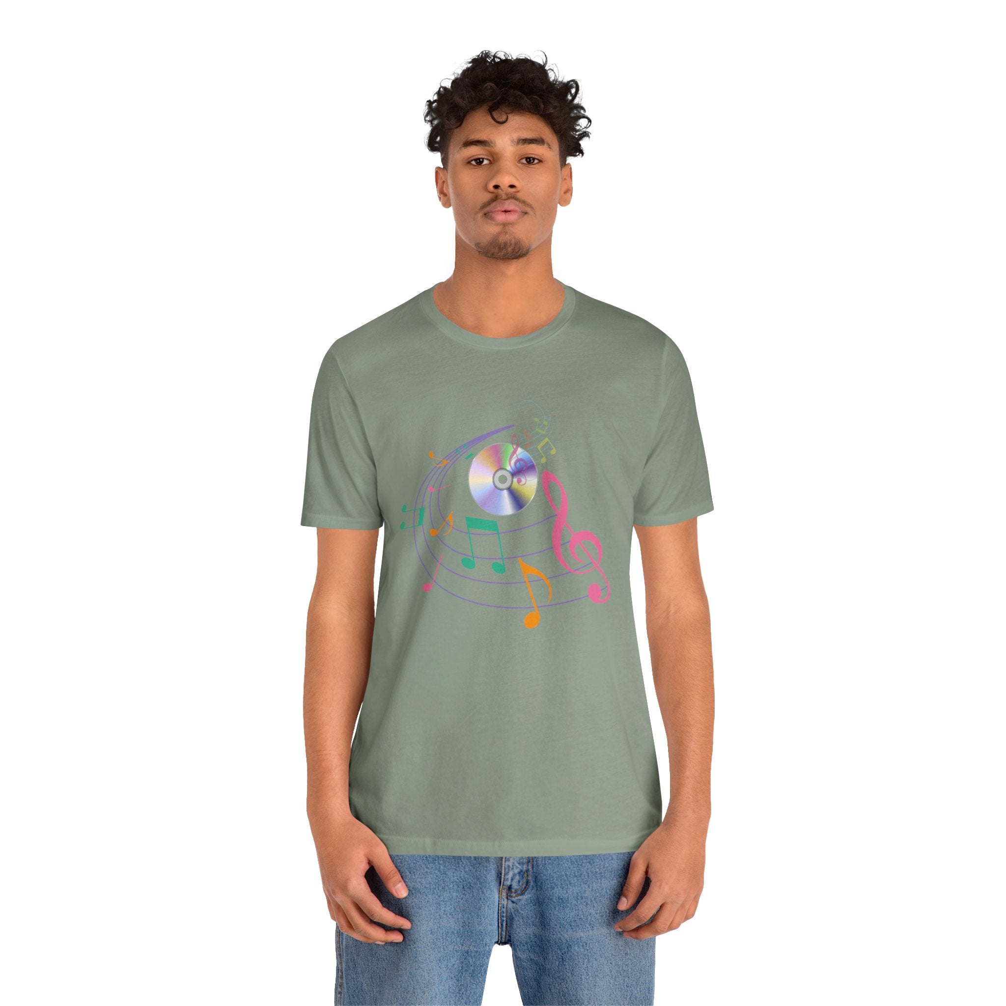 Person wearing a green t-shirt with a colorful graphic design on a white background