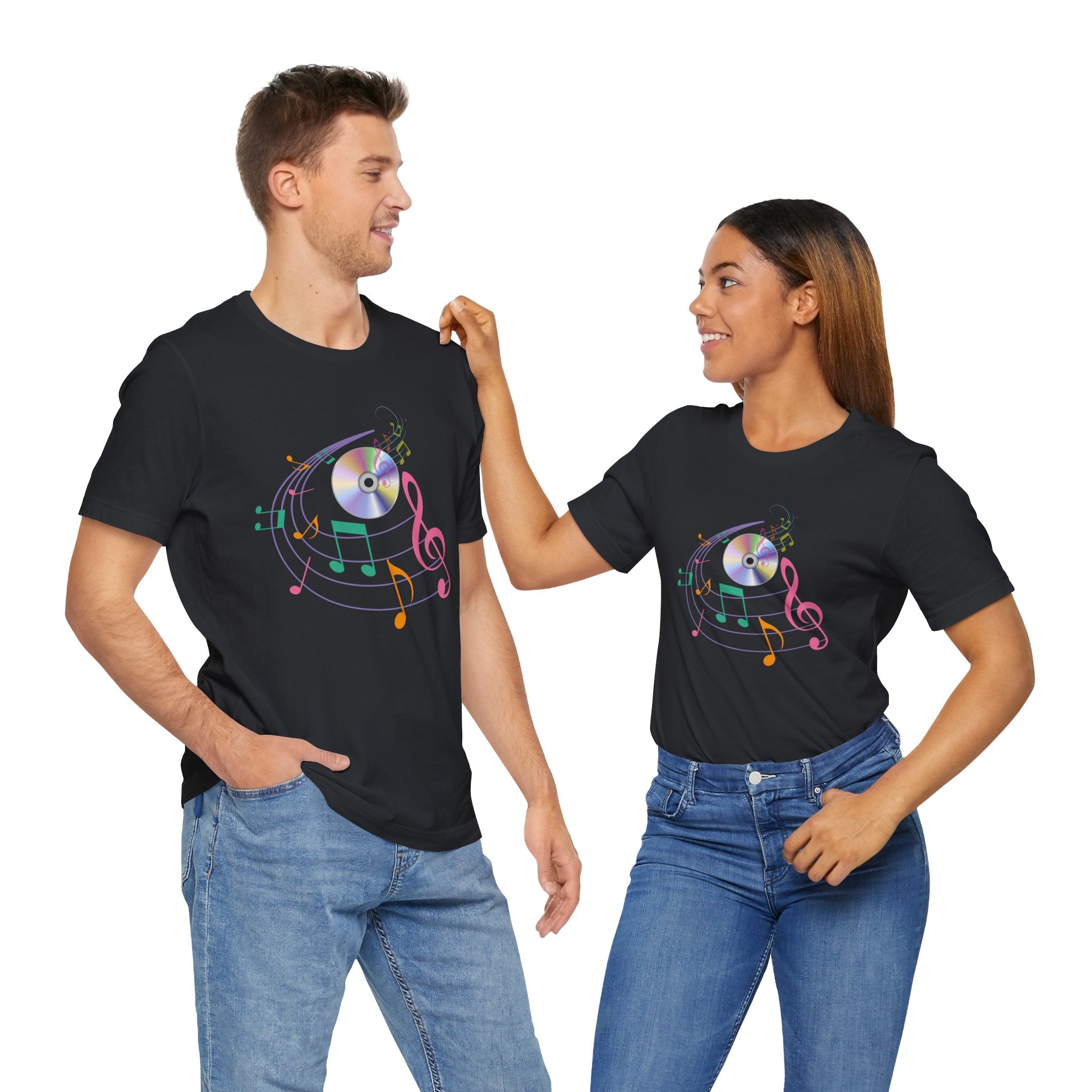 Two people wearing black t-shirts with colorful music note designs on a white background