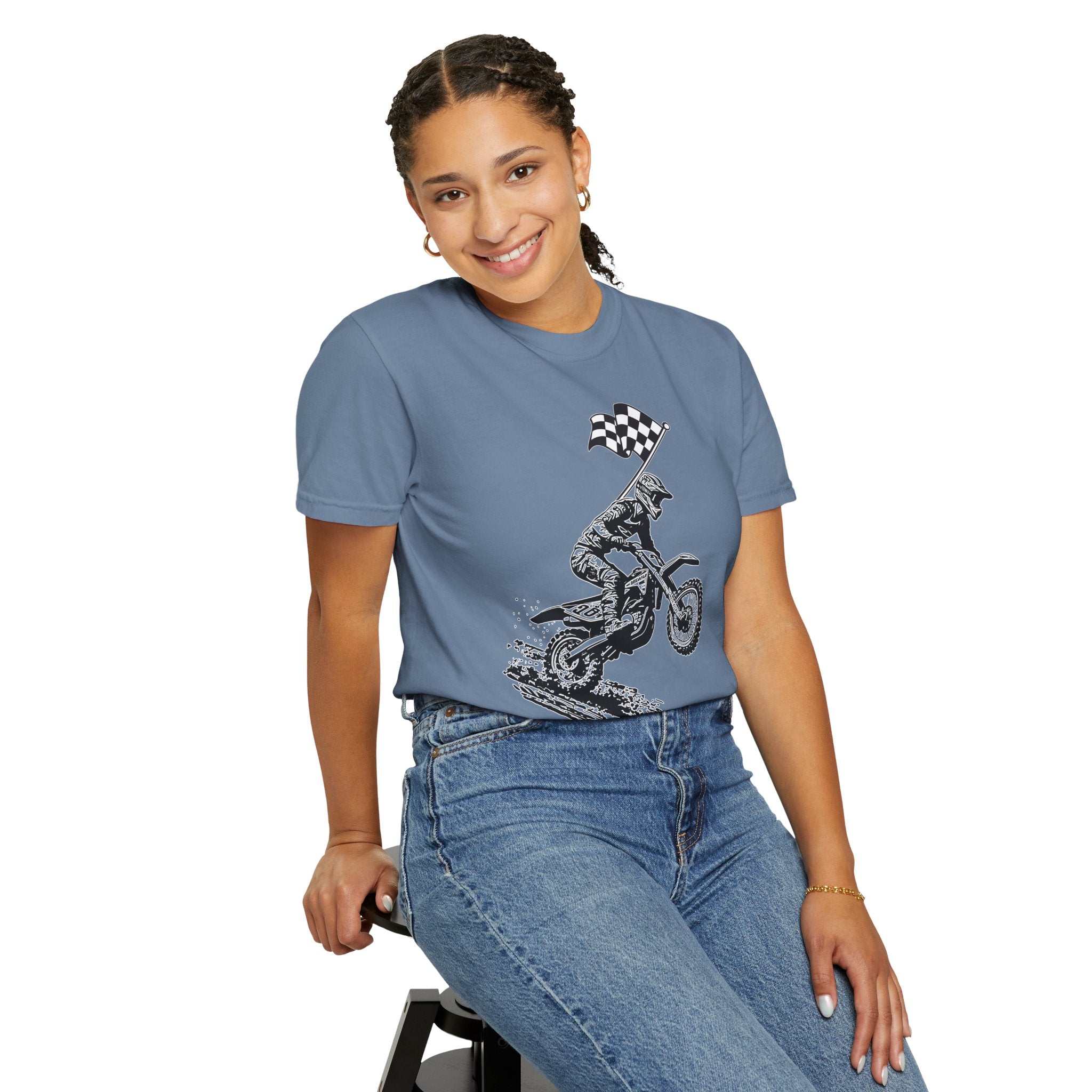 Person wearing a blue t-shirt with a graphic design on a white background