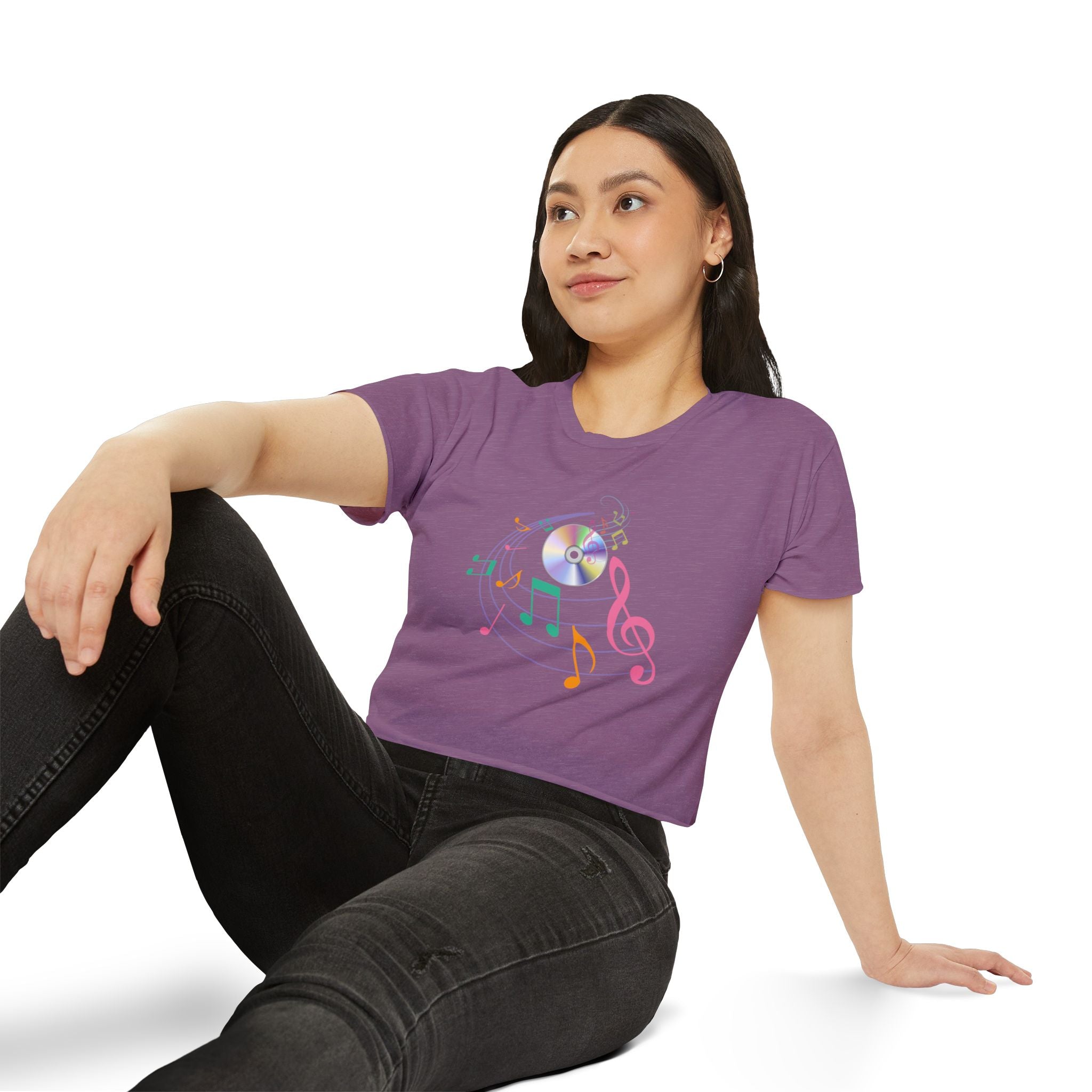 Woman wearing a purple t-shirt with a colorful design on a white background