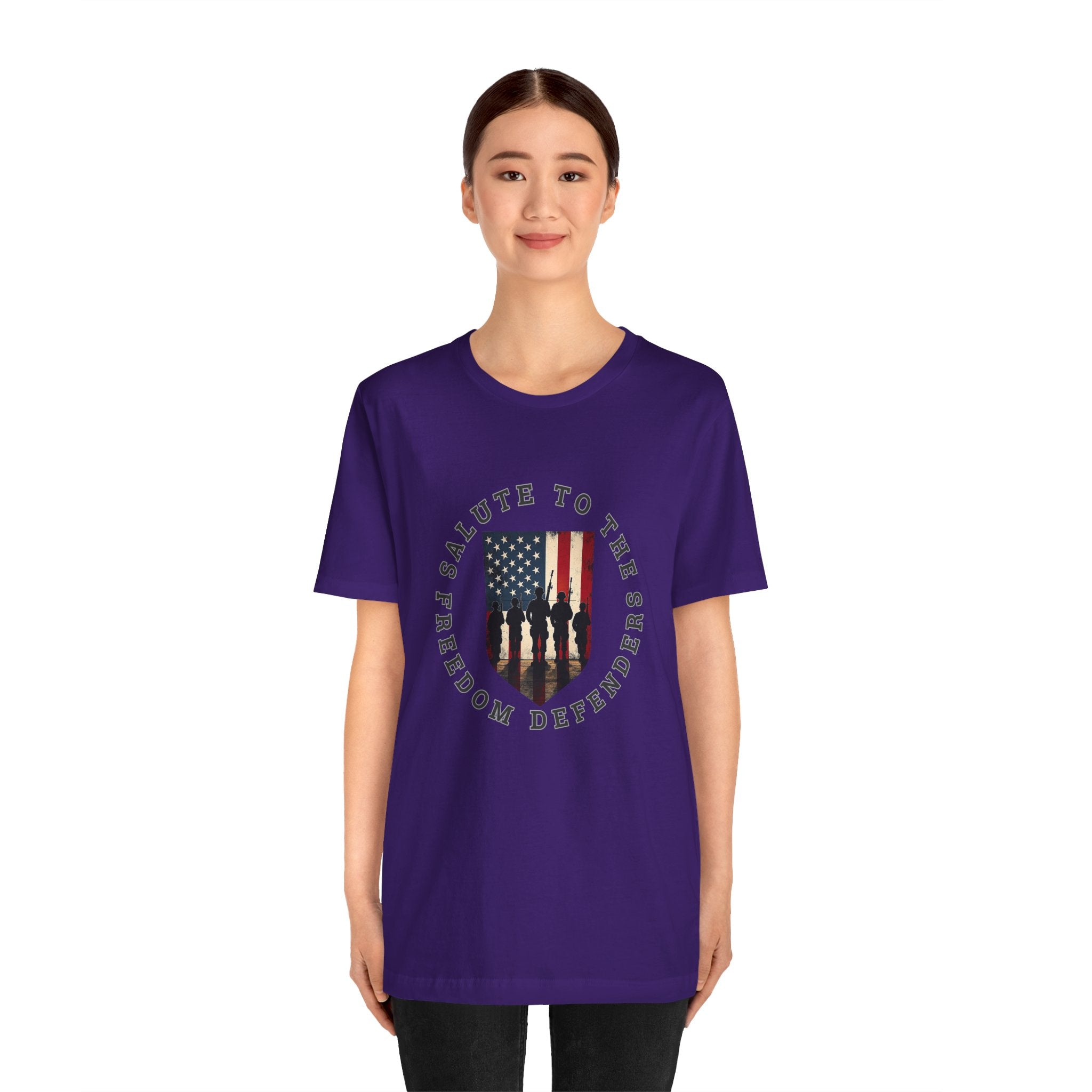 Person wearing a purple t-shirt with a graphic design on a white background