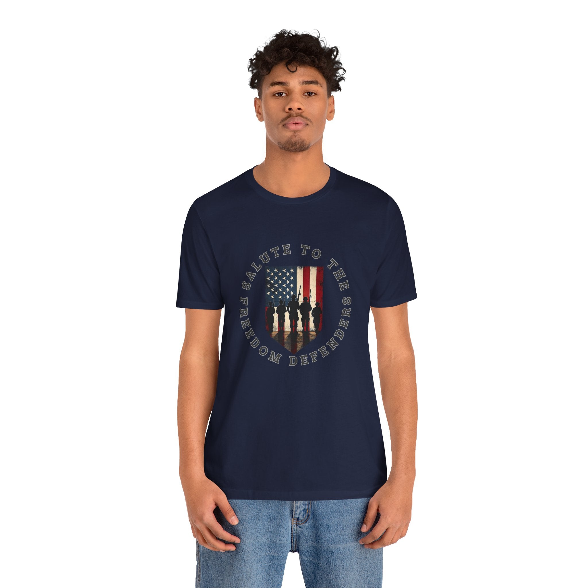 Man wearing a navy blue t-shirt with a graphic design on a white background