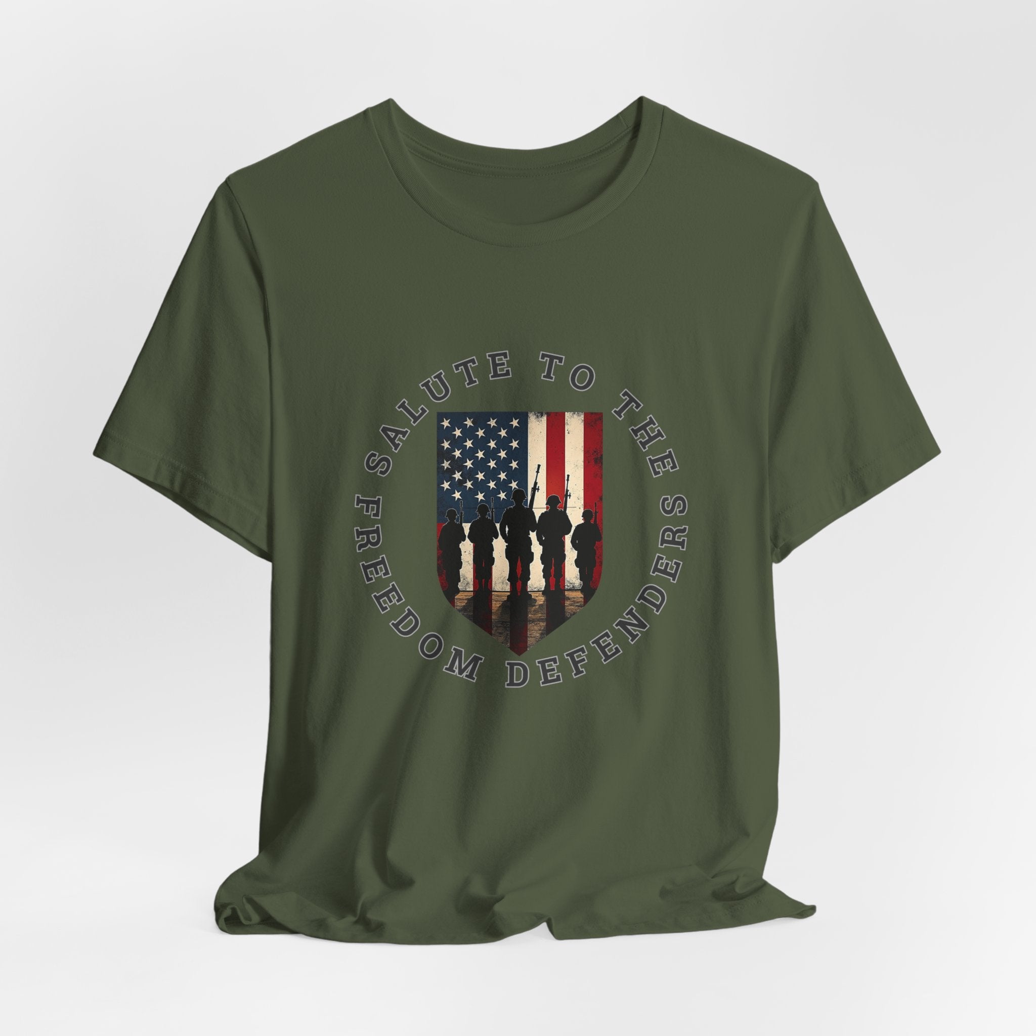 Military green t-shirt with 'Salute to the Freedom Defenders' design featuring an American flag and silhouette of soldiers on a white background.