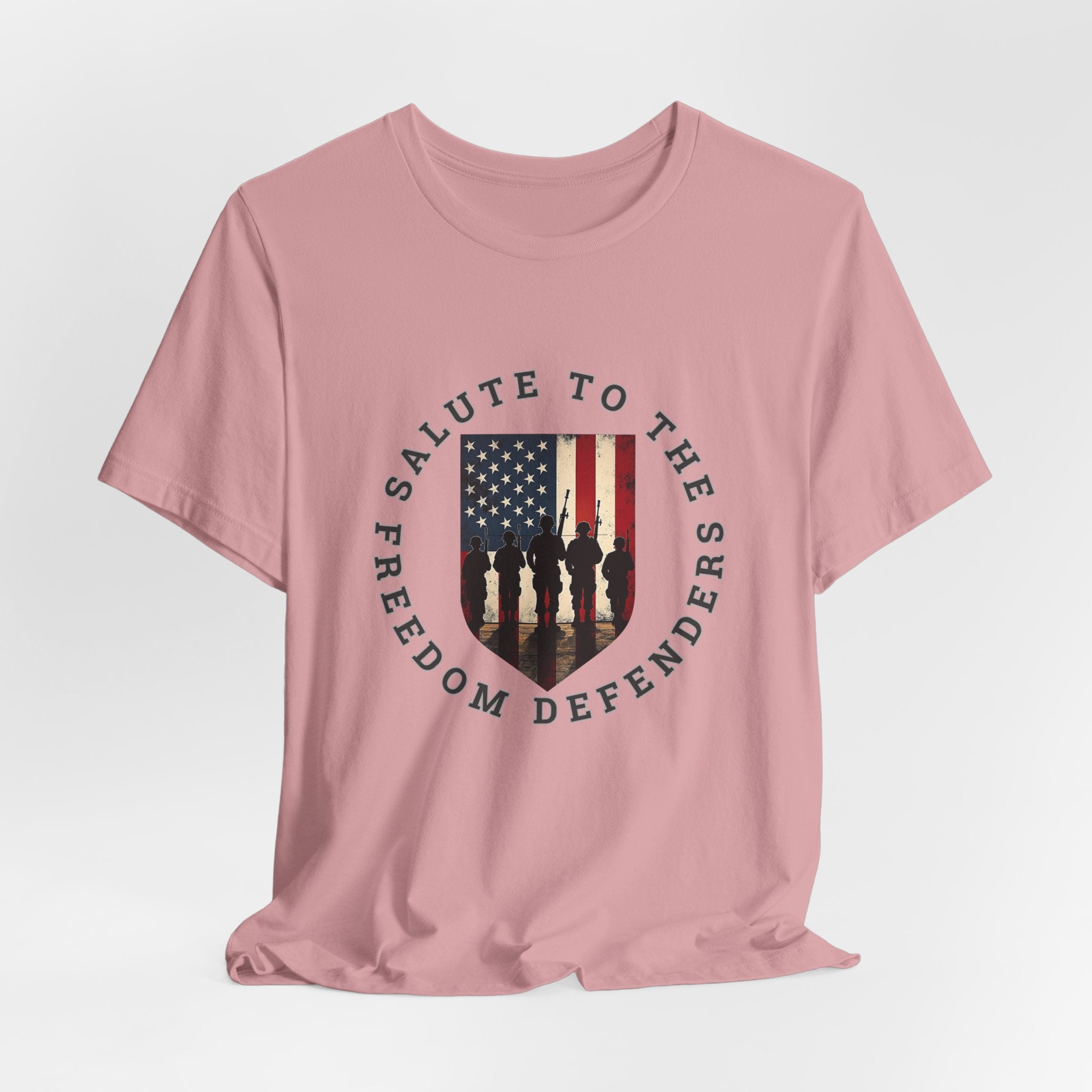 Orchid pink t-shirt with 'Salute to the Freedom Defenders' design featuring an American flag and silhouette of soldiers on a white background.