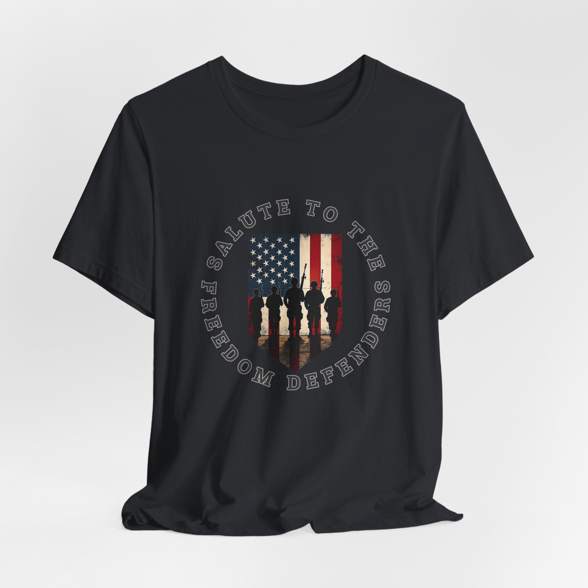 Vintage black t-shirt with 'Salute to the Freedom Defenders' design featuring an American flag and silhouette of soldiers on a white background.