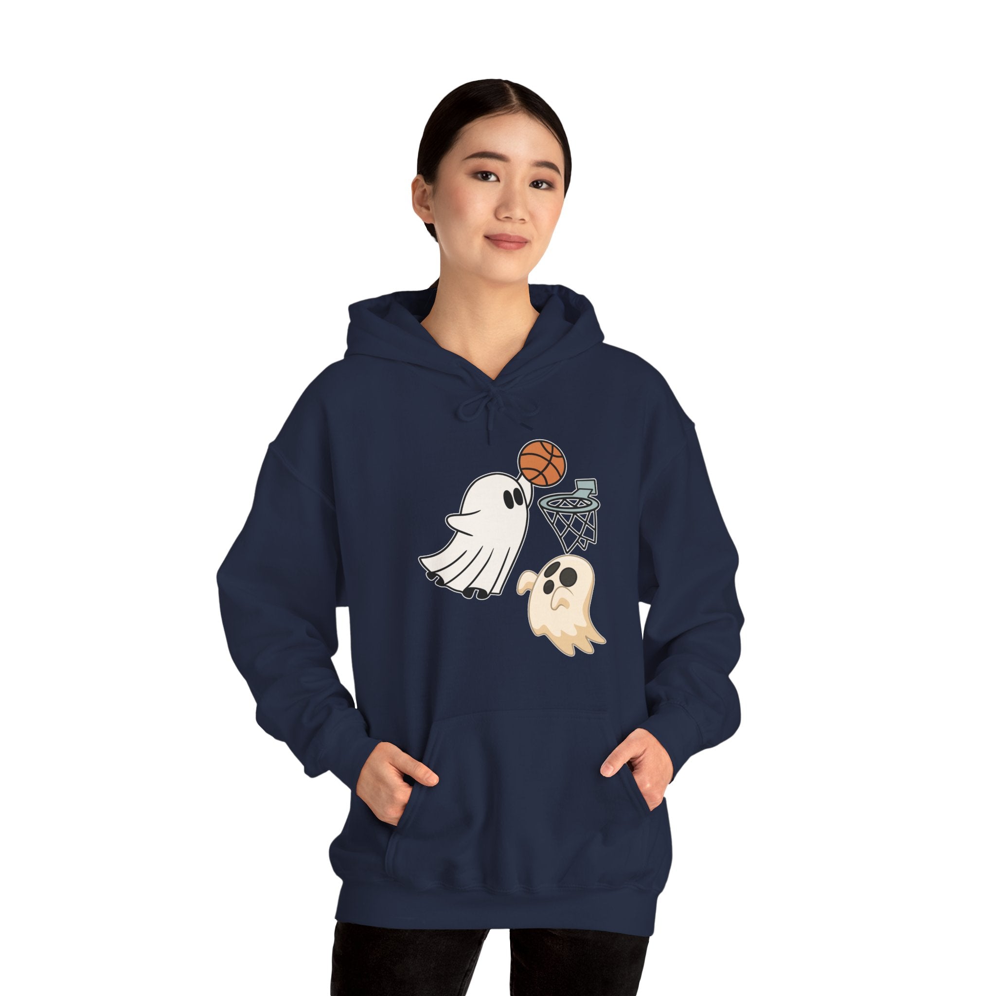Person wearing a navy blue hoodie with ghost and basketball design on a white background