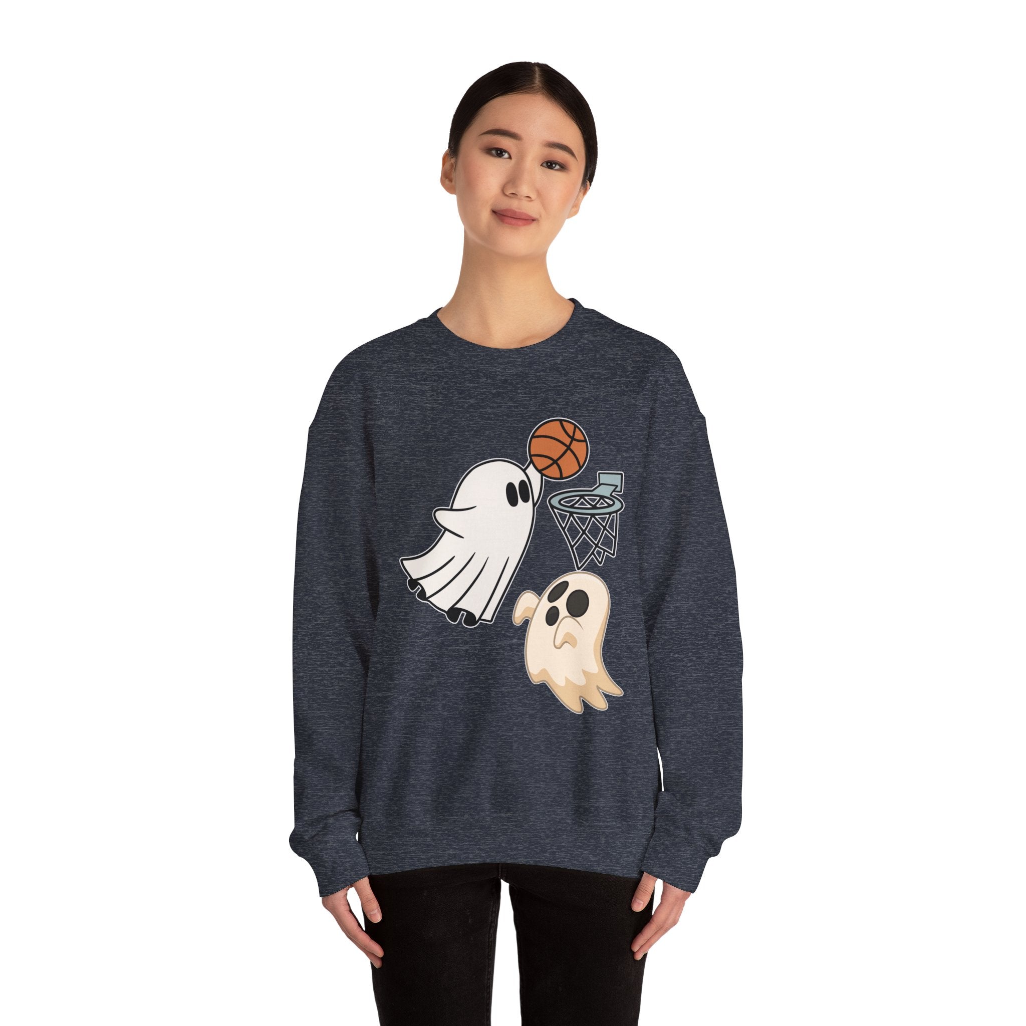 Person wearing a dark blue sweatshirt with ghost and basketball design on a white background