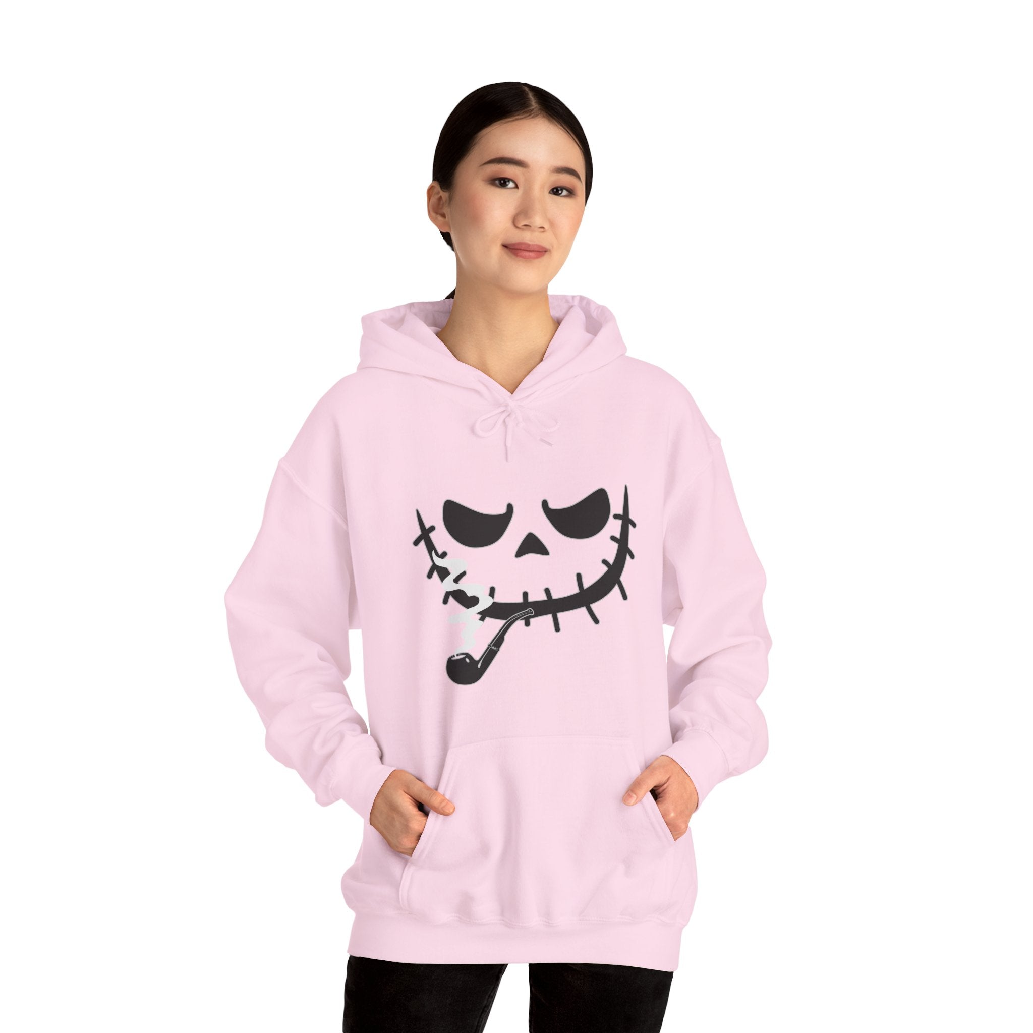 Person wearing a pink hoodie with a black graphic design on a white background