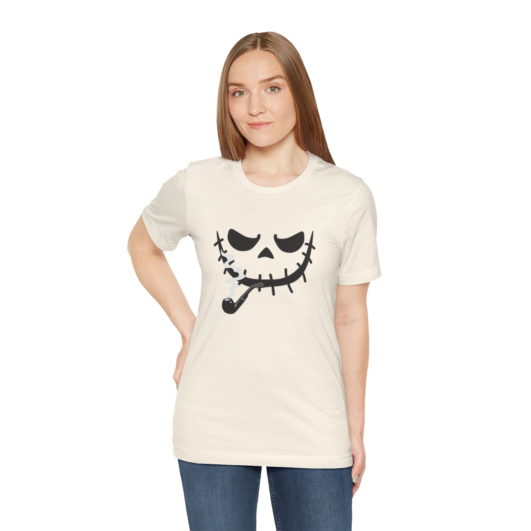 Woman wearing a cream t-shirt with a black graphic design on a white background