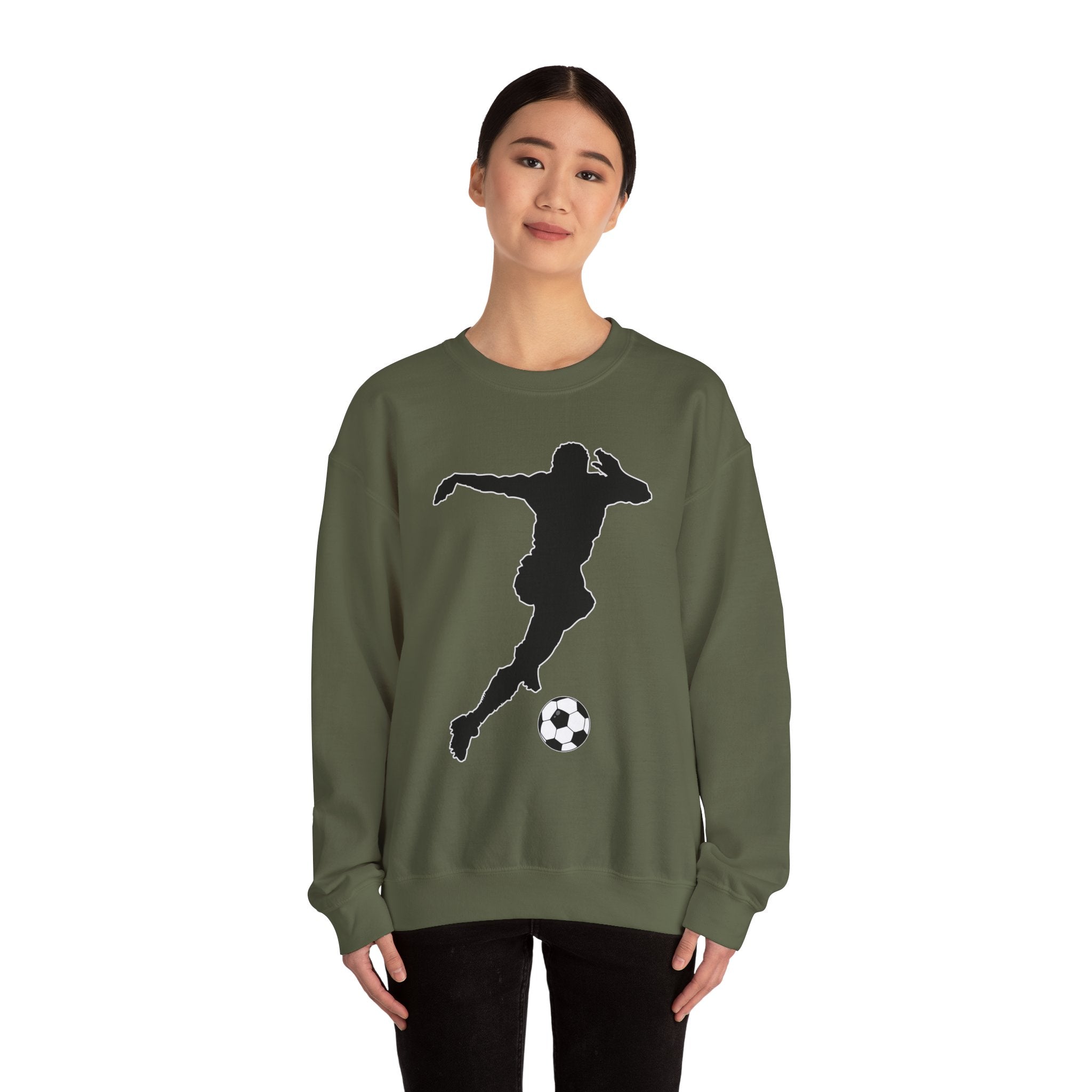Person wearing a green sweatshirt with a black silhouette of a soccer player and ball design on a white background