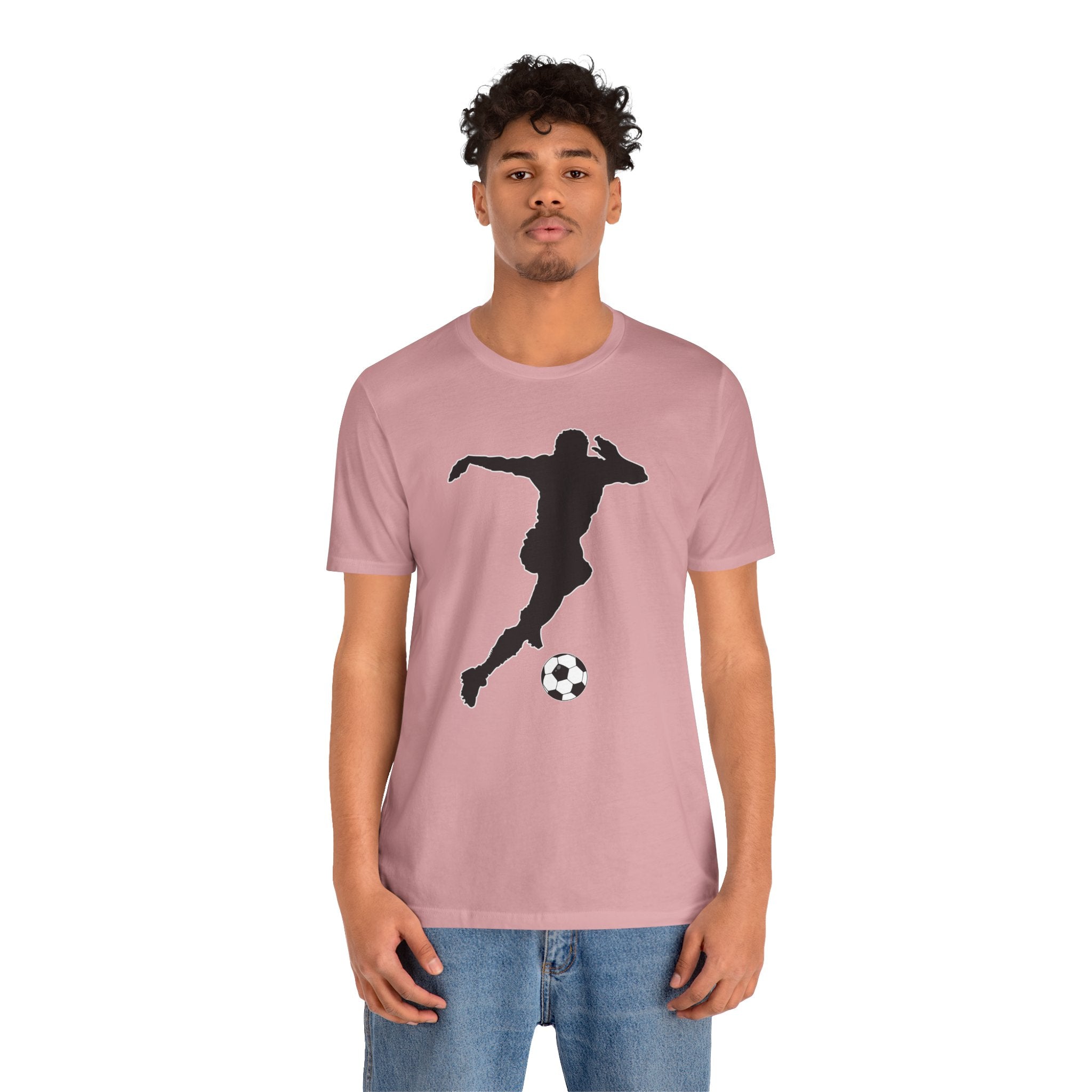 Person wearing a pink t-shirt with a black silhouette design on a white background