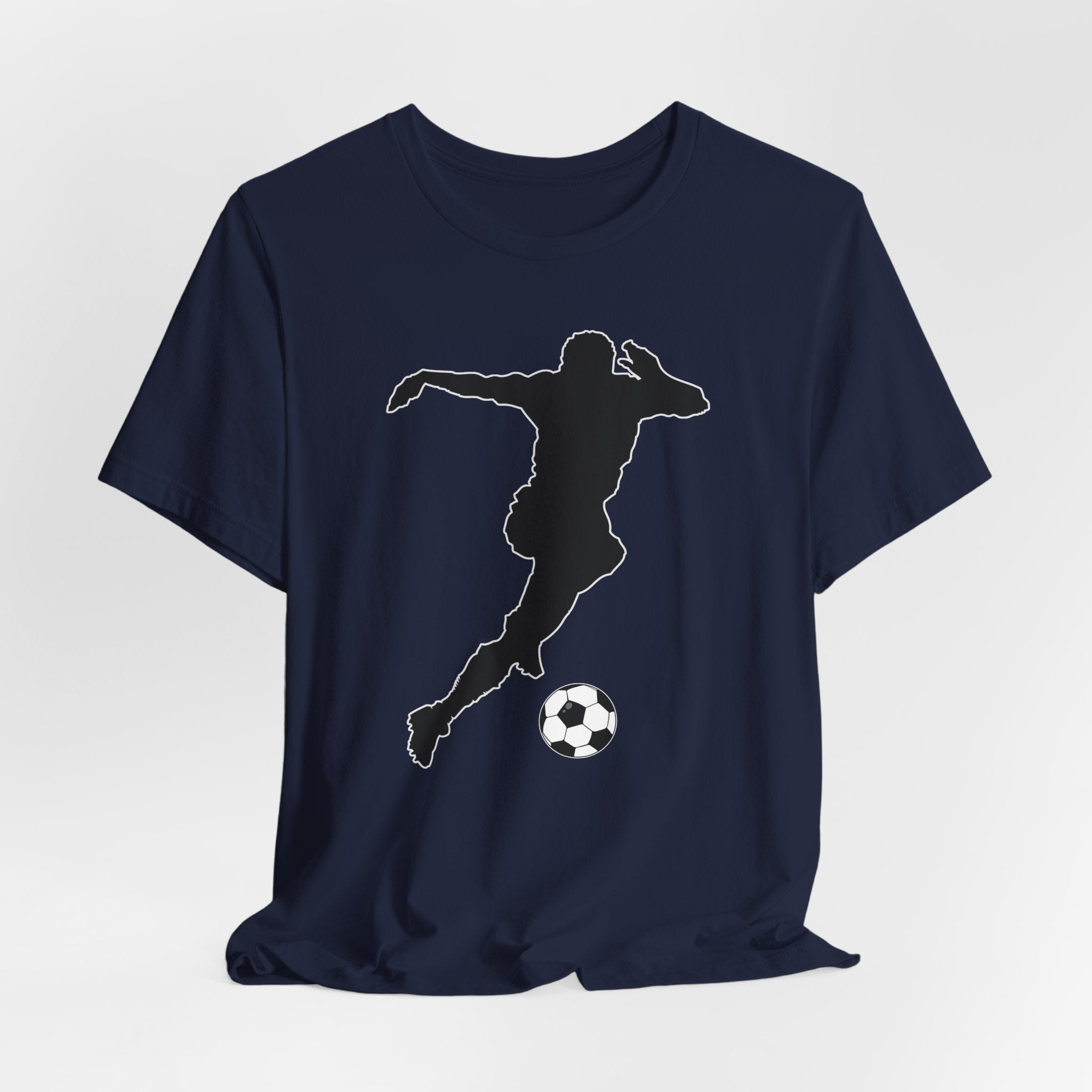 Navy blue t-shirt with a silhouette of a soccer player and ball on a light gray background