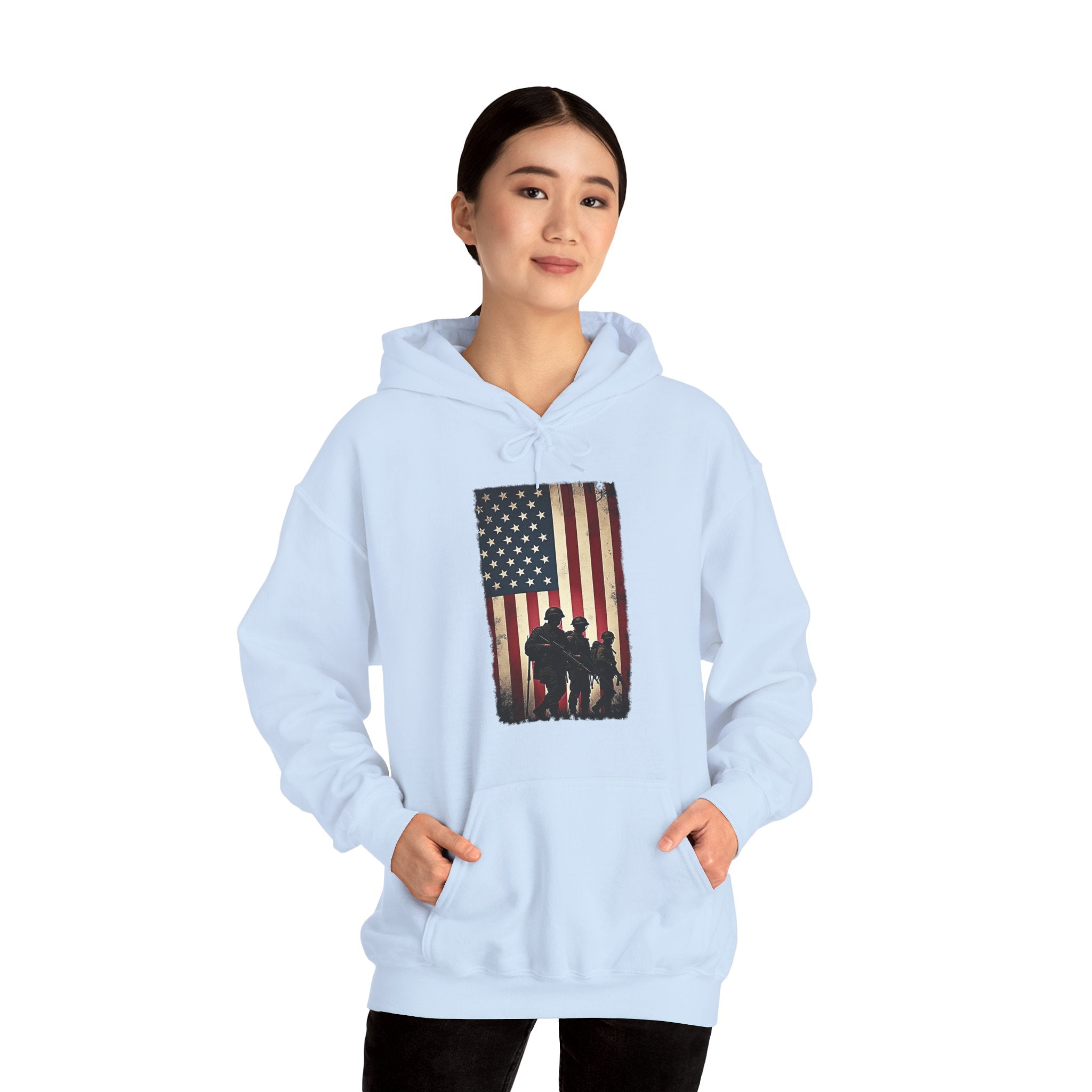 Light blue hoodie with American flag and silhouette design worn by a person on a white background