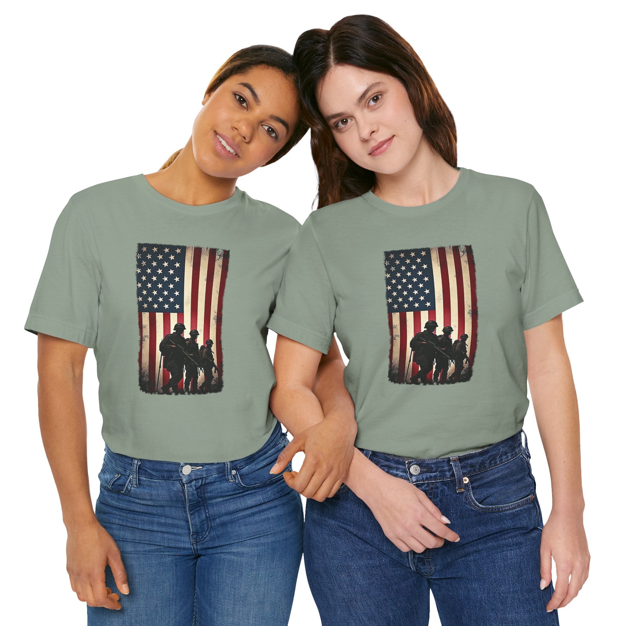 Two women wearing matching green t-shirts with an American flag and silhouette design on a white background.