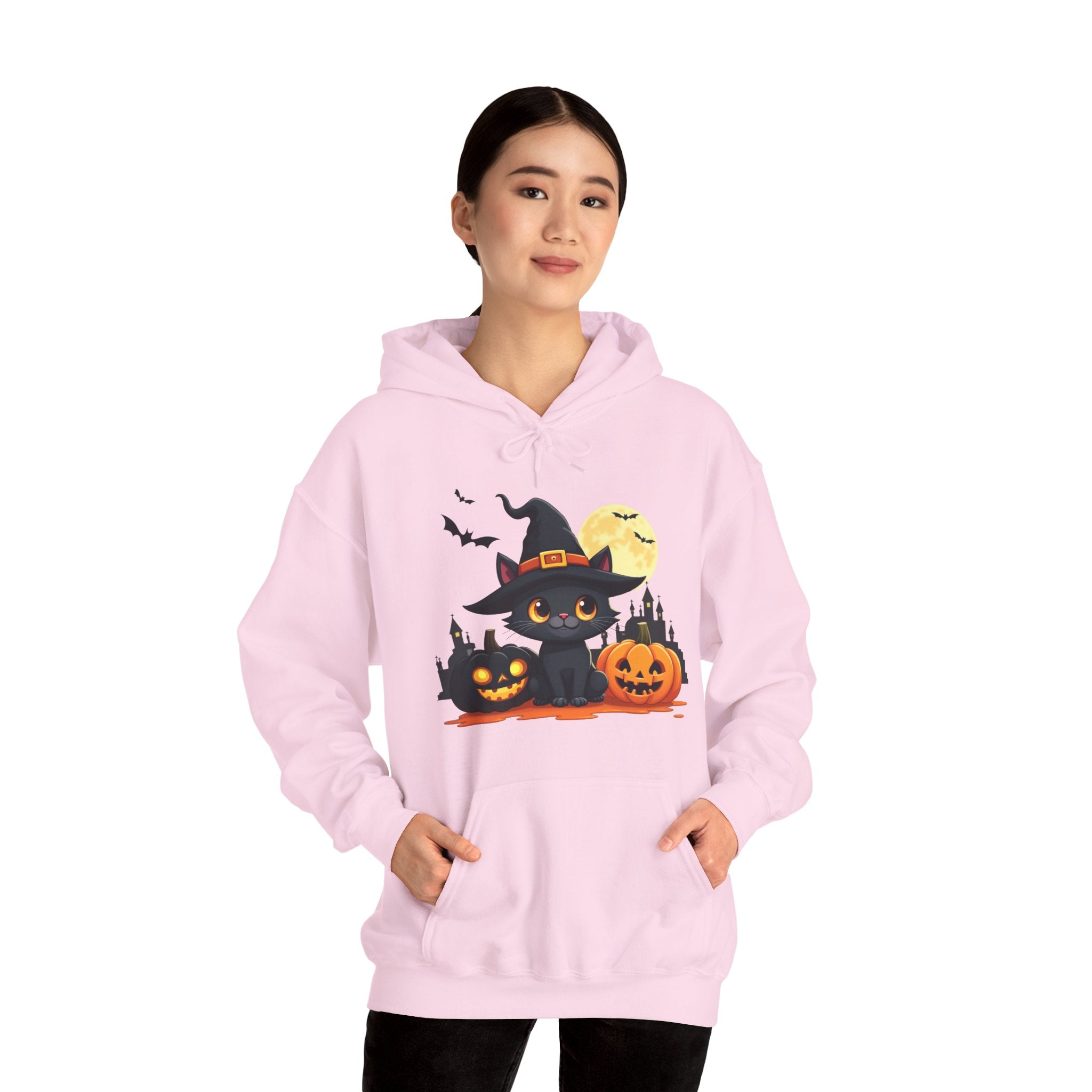 Person wearing a pink hoodie with Halloween-themed design on a white background