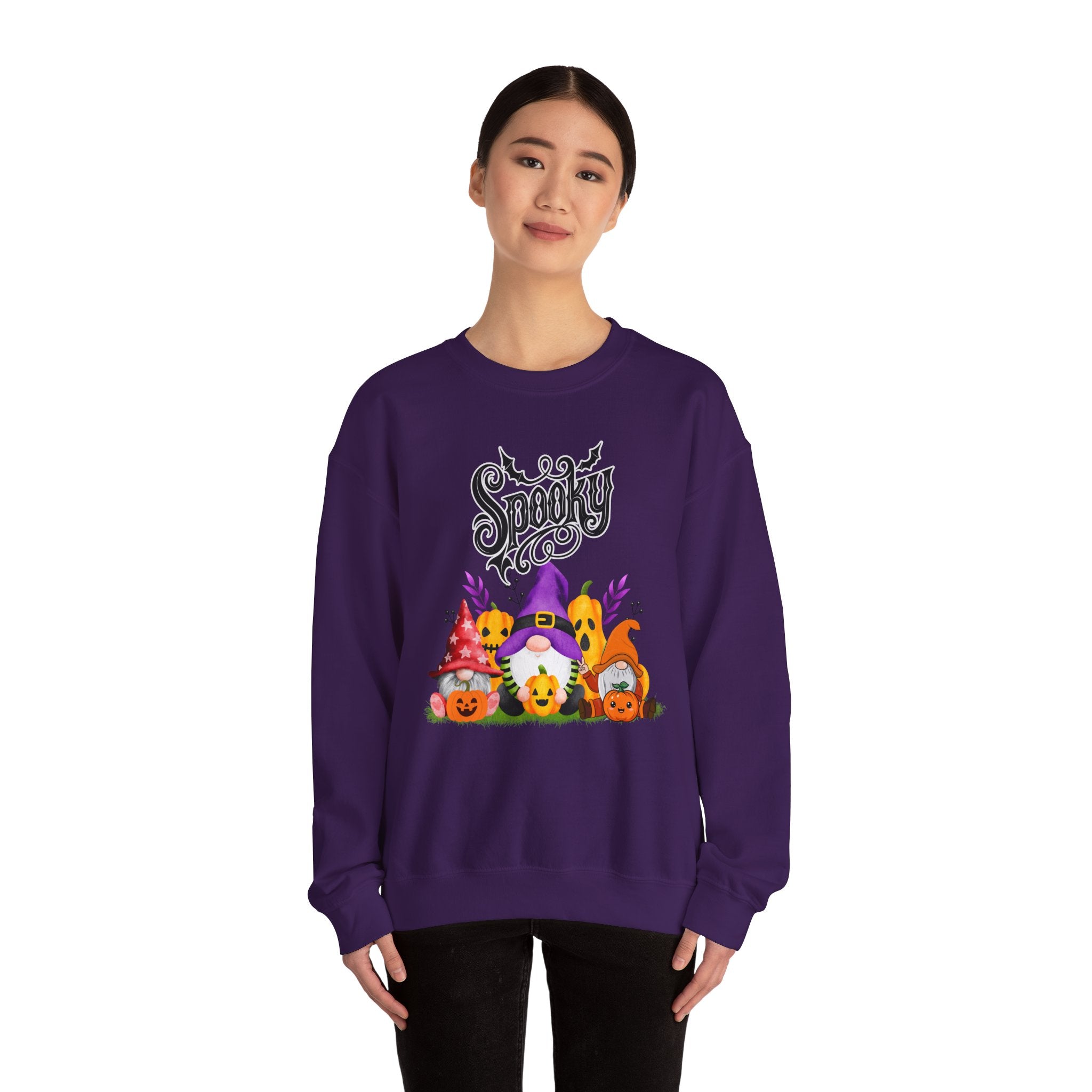 Person wearing a purple sweatshirt with Halloween-themed design on a white background