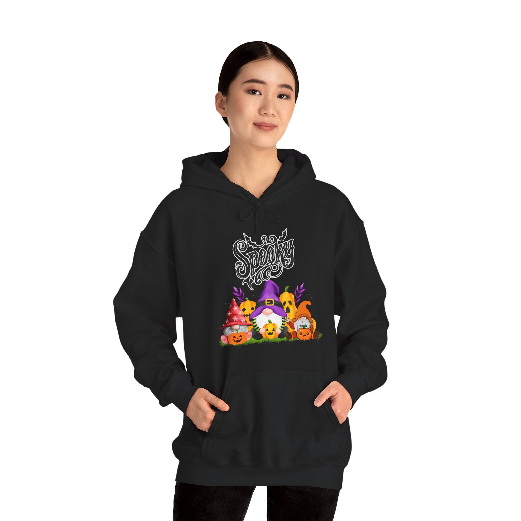 Person wearing a black hoodie with Halloween-themed design on a white background