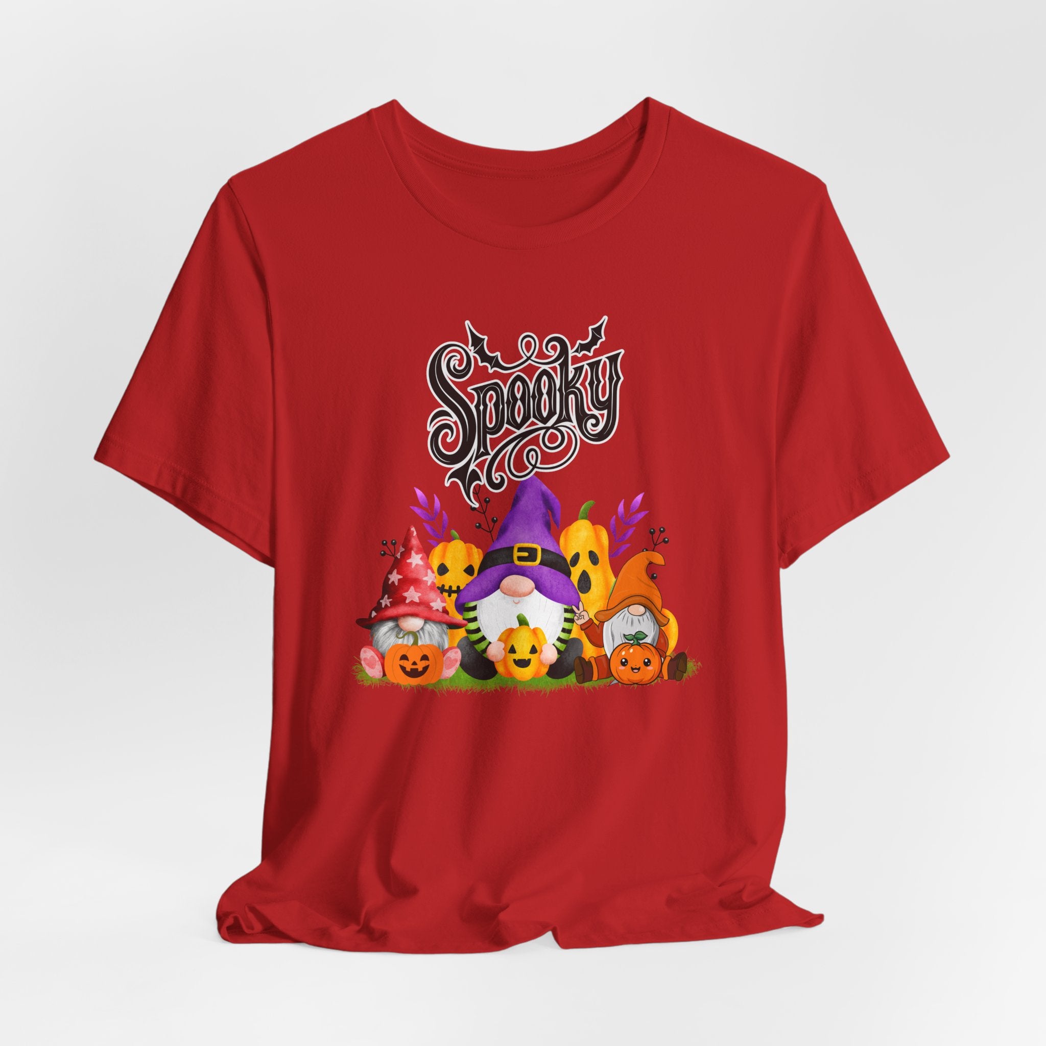 Red t-shirt with Halloween-themed design featuring spooky gnomes and pumpkins on a white background