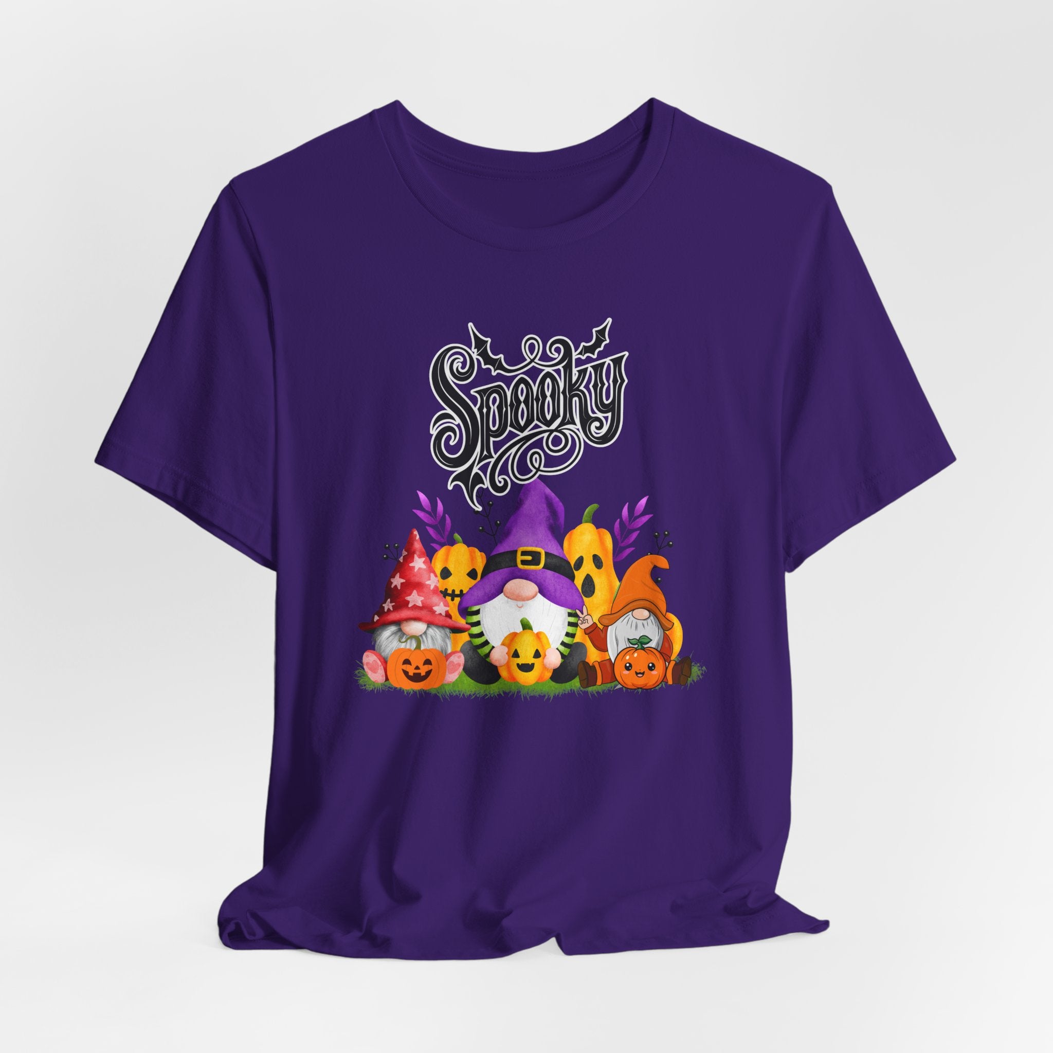Team purple t-shirt with Halloween-themed design featuring spooky gnomes and pumpkins on a white background