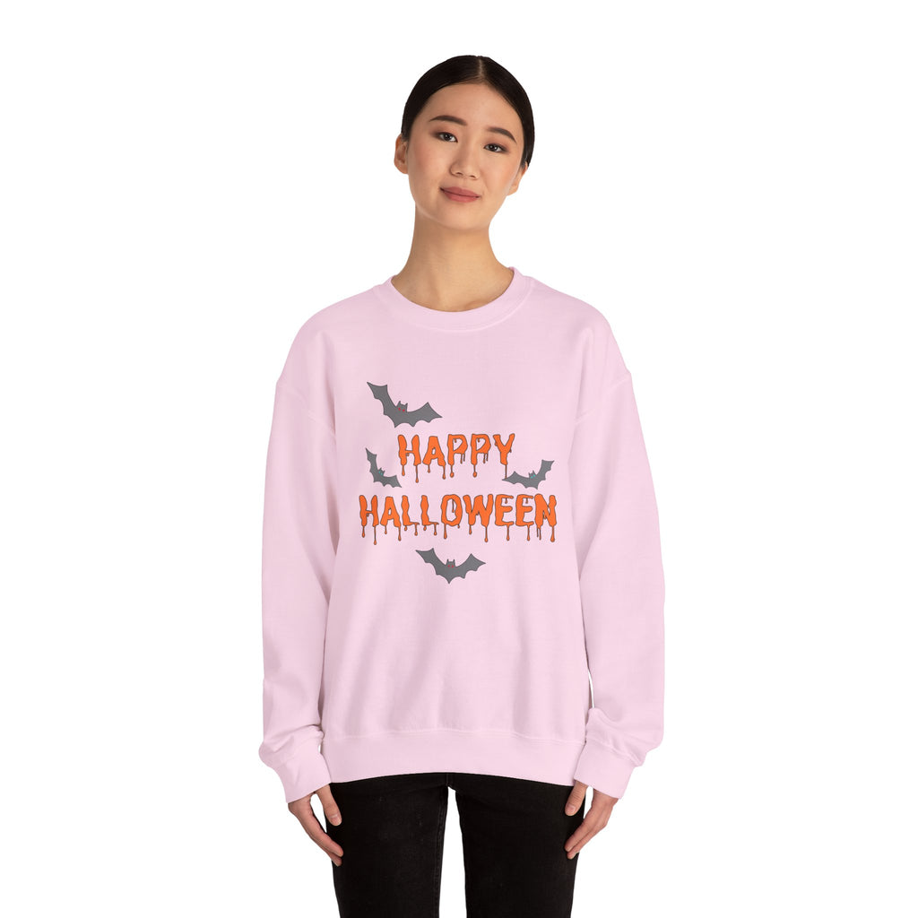 Person wearing a pink 'Happy Halloween' sweatshirt with bat designs on a white background