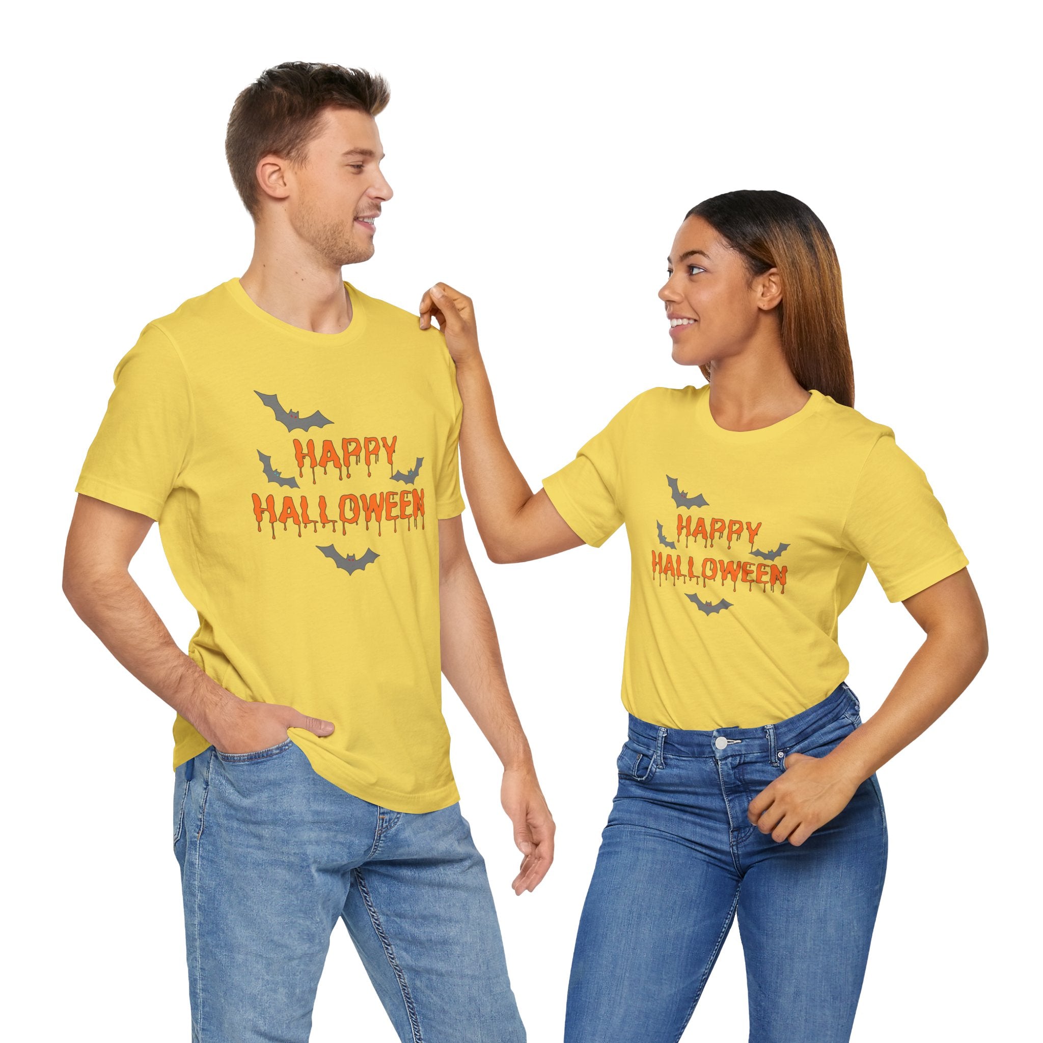 Two people wearing yellow 'Happy Halloween' t-shirts on a white background